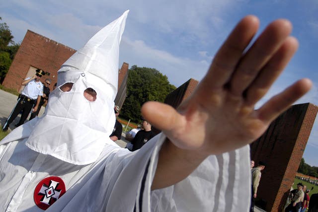 <p>A member of the Ku Klux Klan salutes during American Nazi Party rally (file photo) </p>