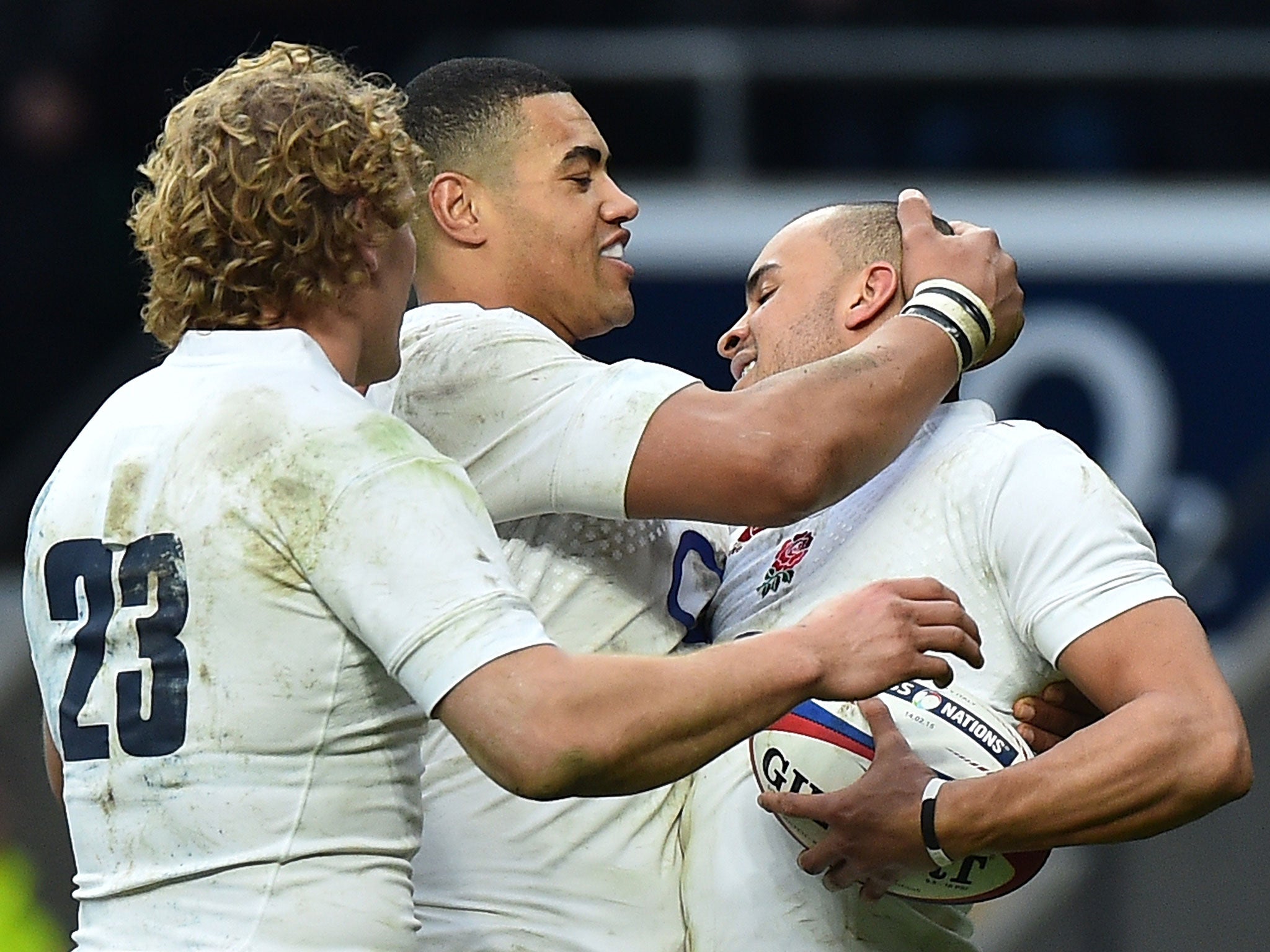 Billy Twelvetrees and Luther Burrell celebrates with Jonathan Joseph after he scores his second try