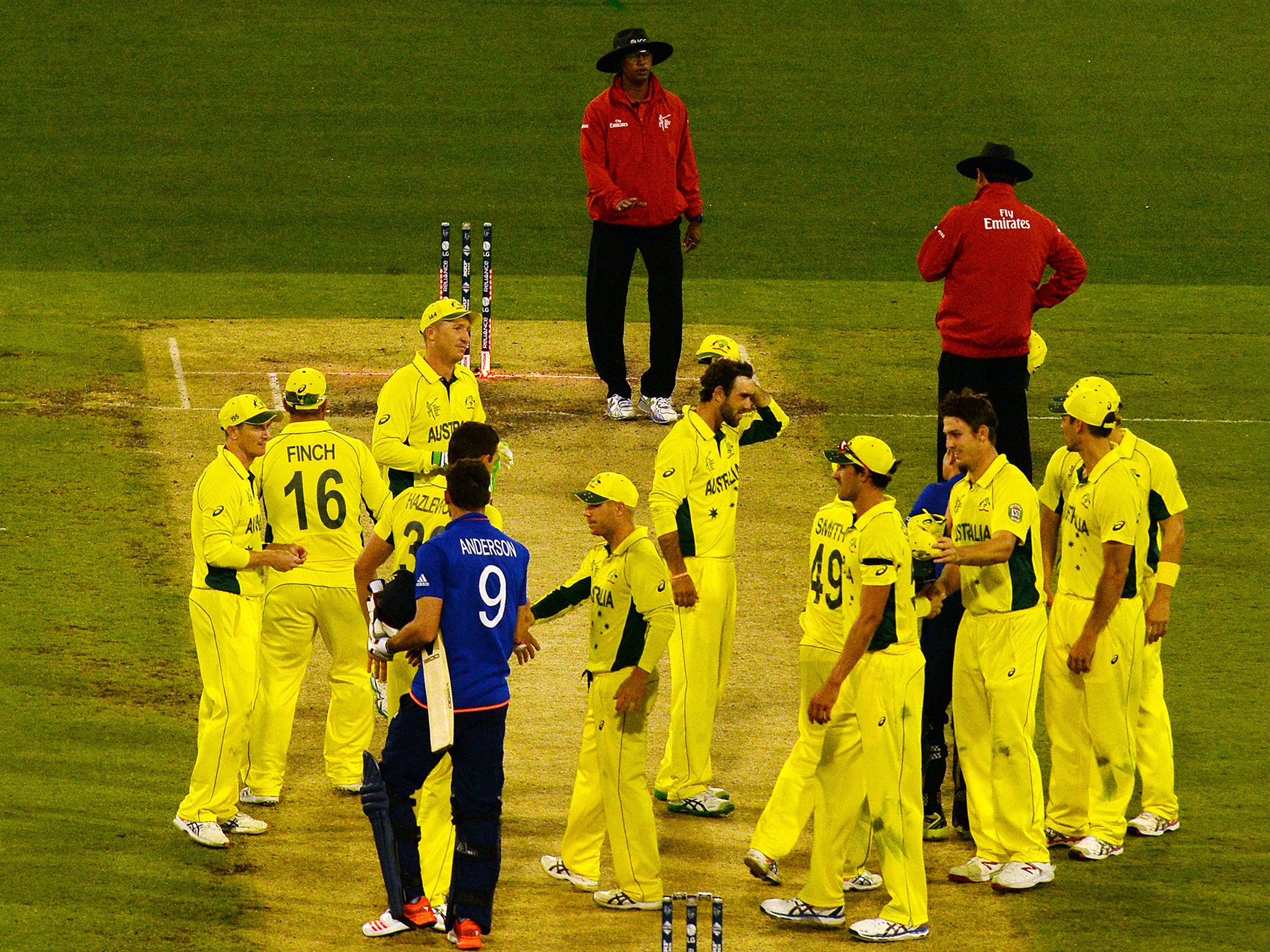 Australian players celebrate their victory during the Pool A 2015 Cricket World Cup match between Australia and England at the Melbourne Cricket Ground