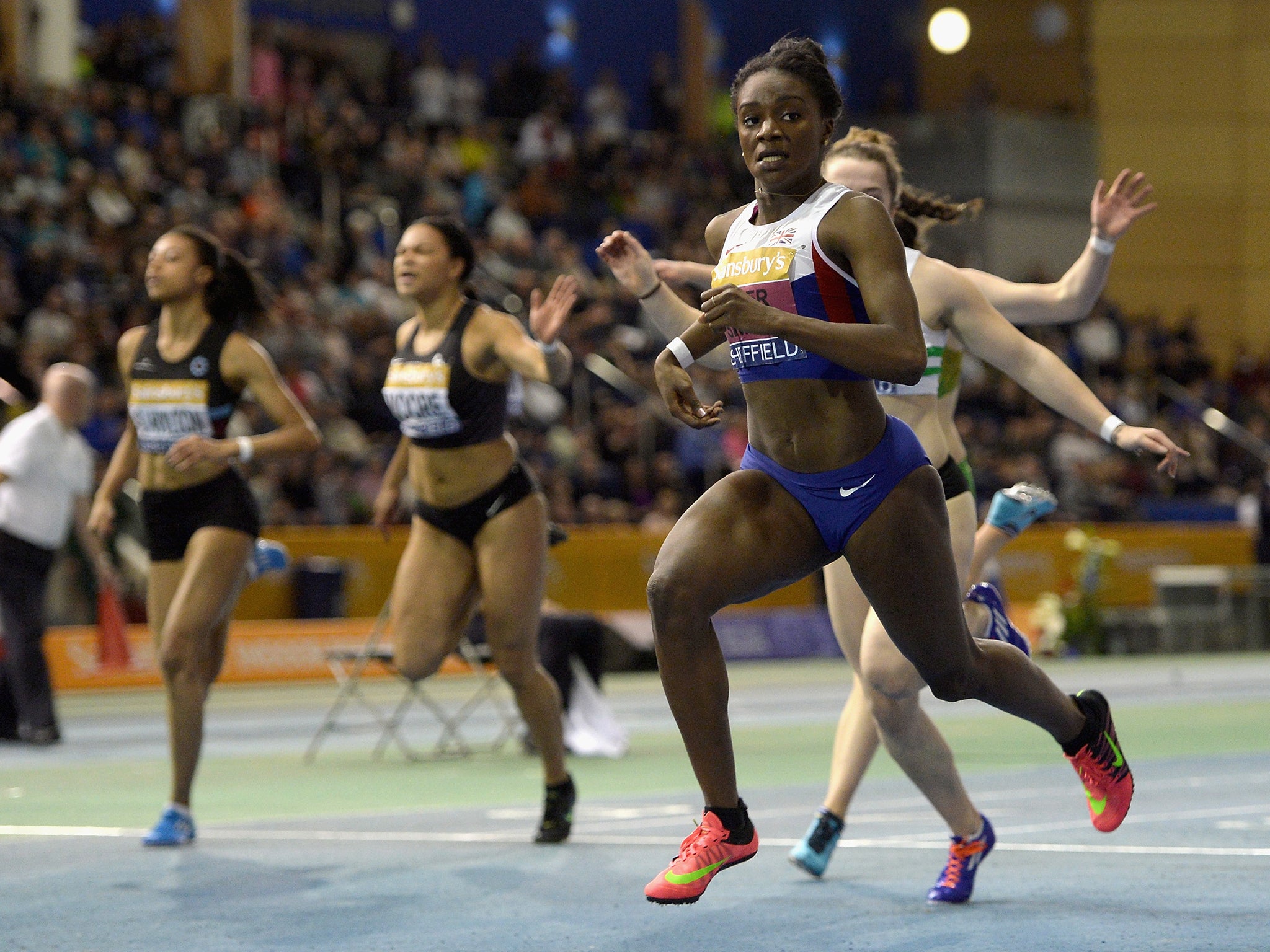 Dina Asher-Smith crosses the line to the womens 60 metres final during the Sainsbury's British Athletics Indoor Championships