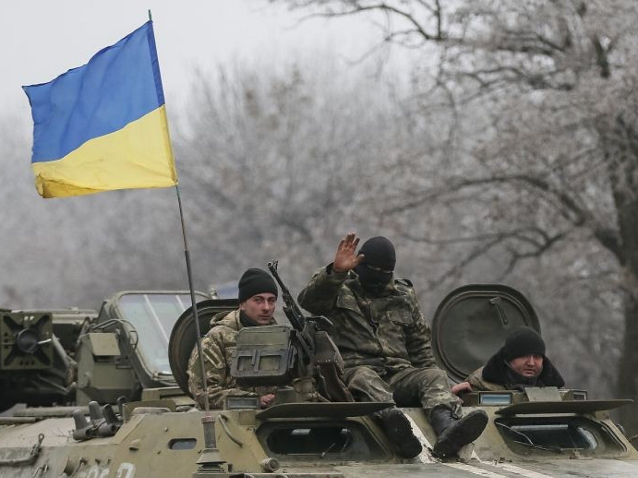 Ukrainian armed forces ride on a military vehicle near Artemivsk