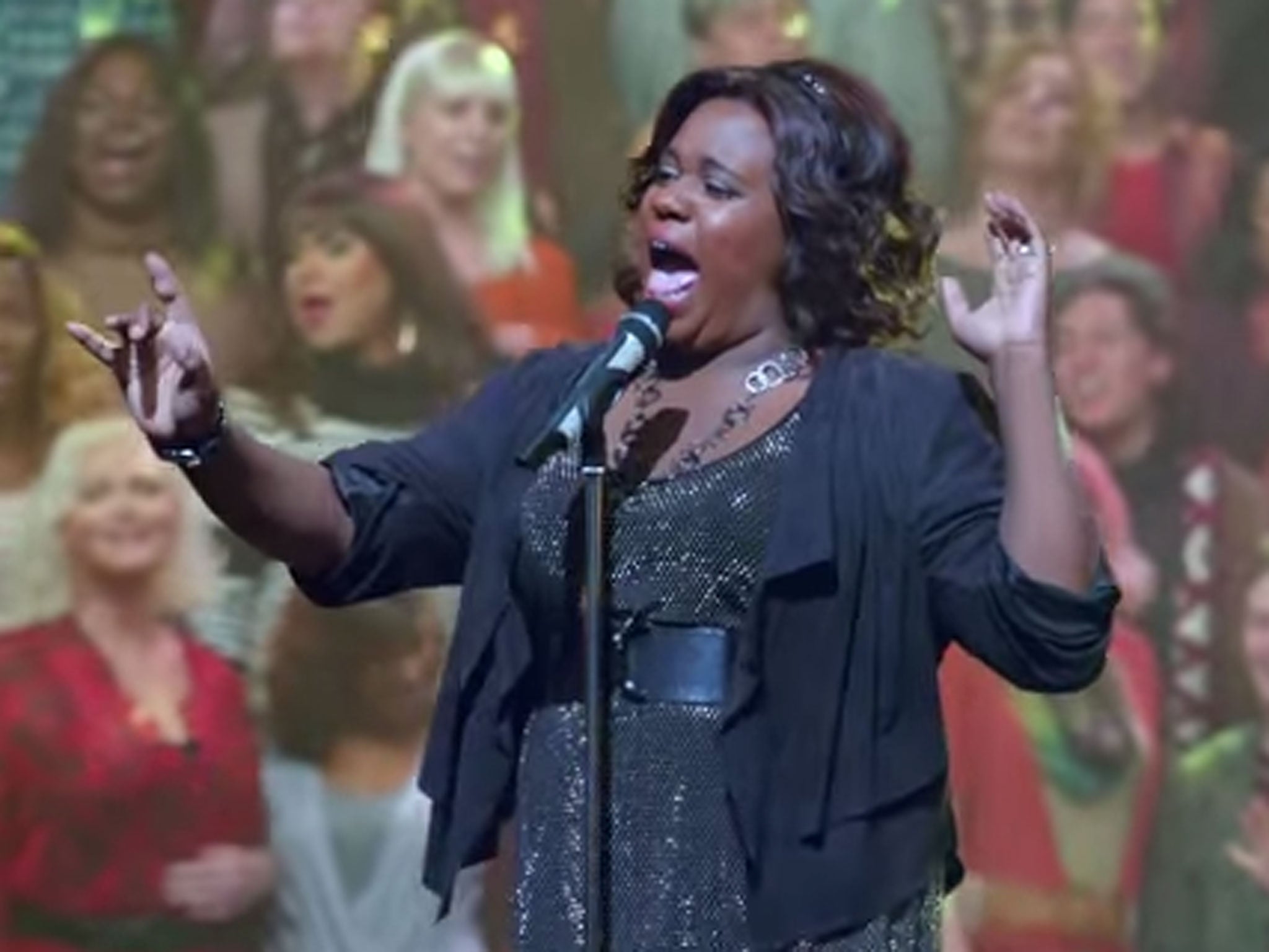 Unique (Alex Newell) performs with the choir