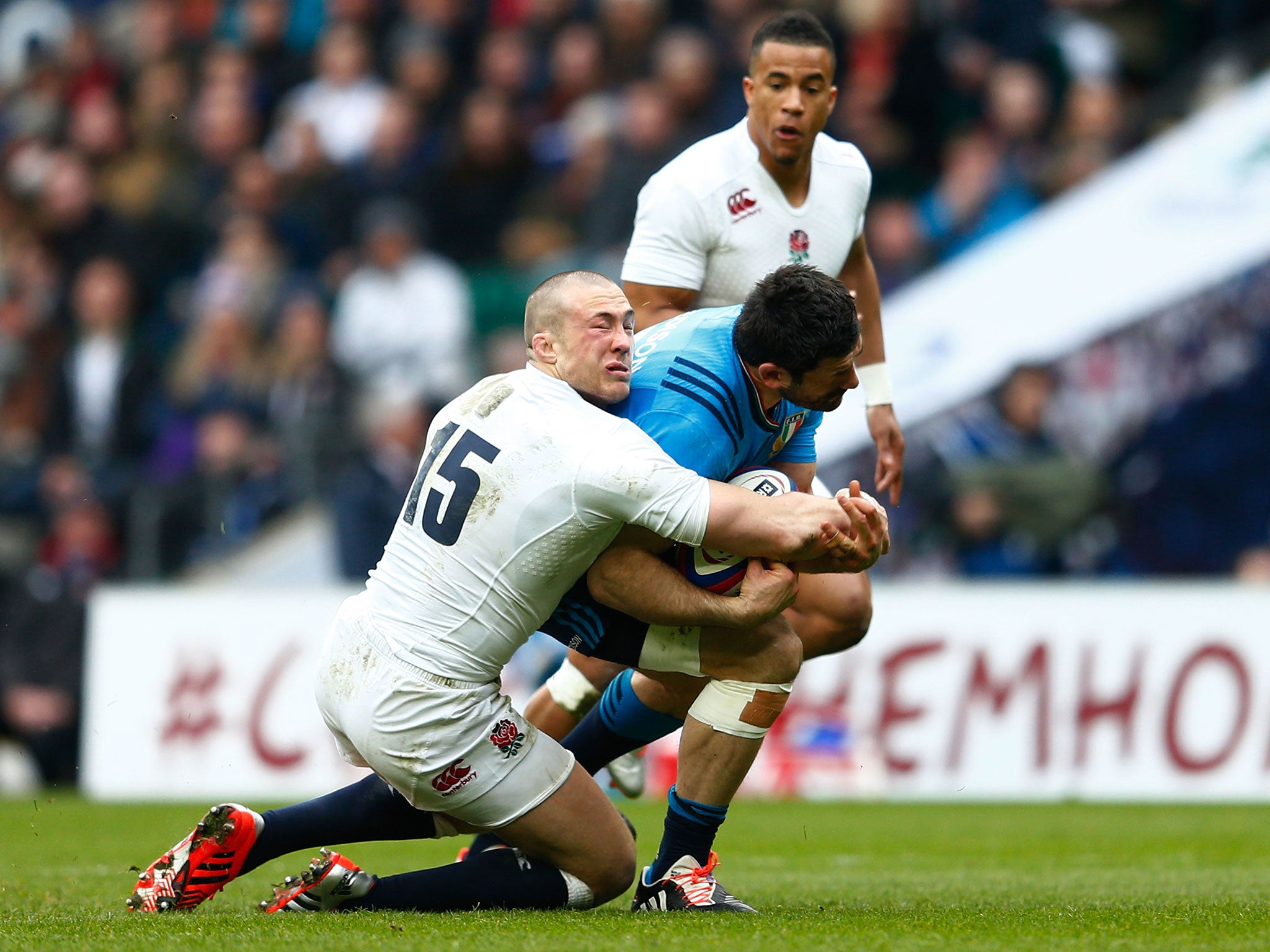 Brown, left, was hurt as he attempted to tackle Andrea Masi