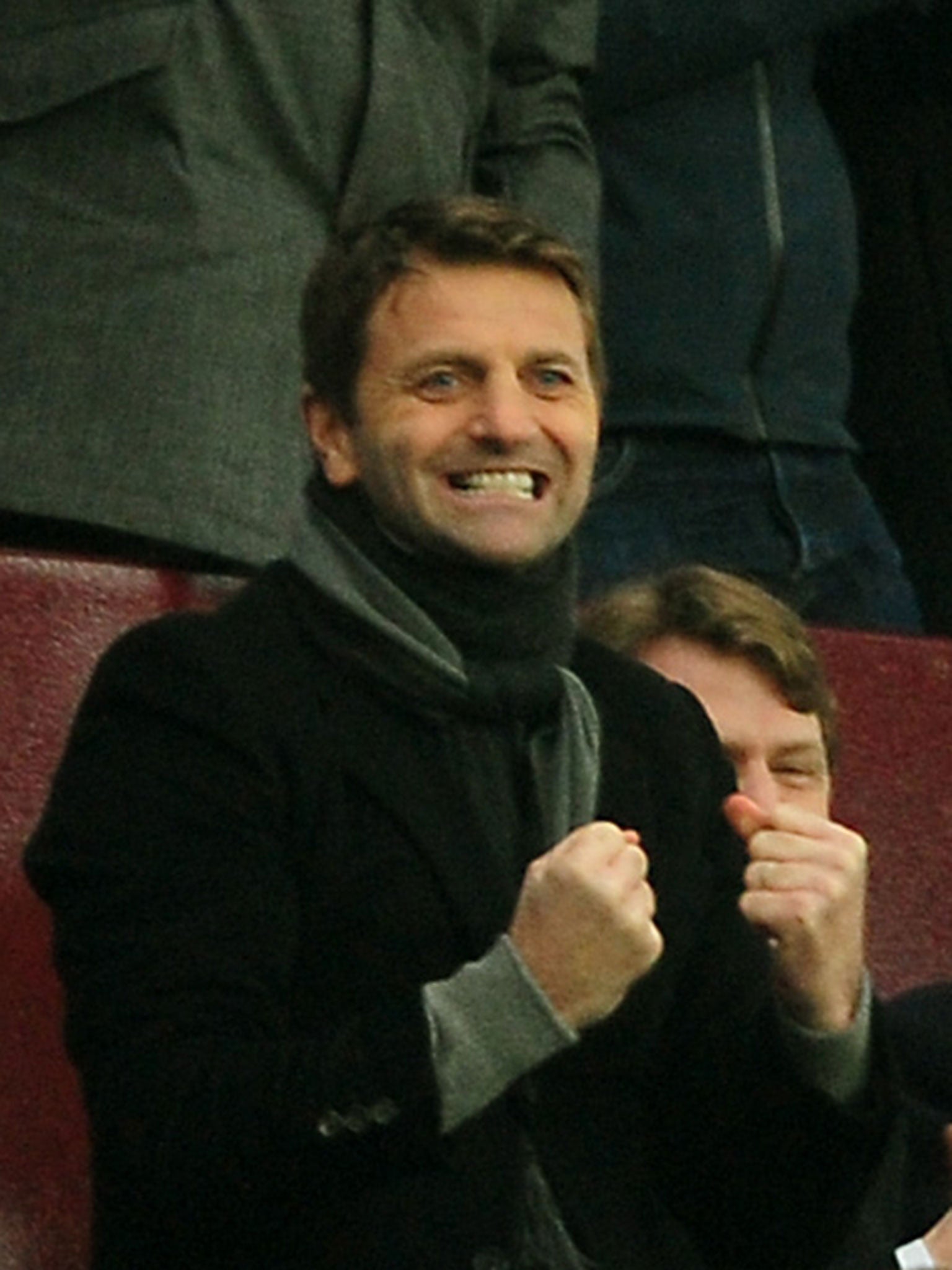 Tim Sherwood celebrates one of Villa’s goals from the stands