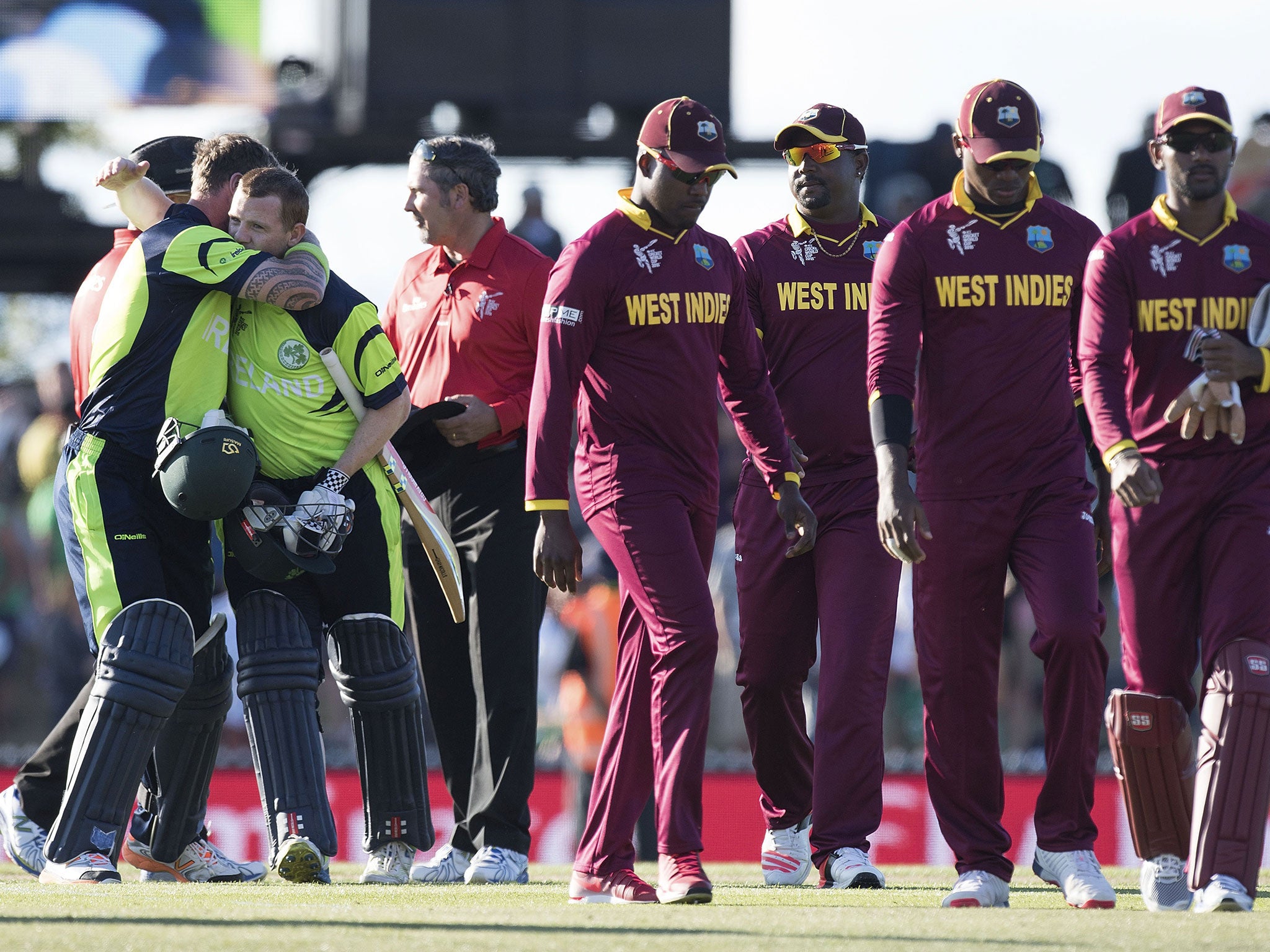 West Indies leave the field as Ireland celebrate their victory