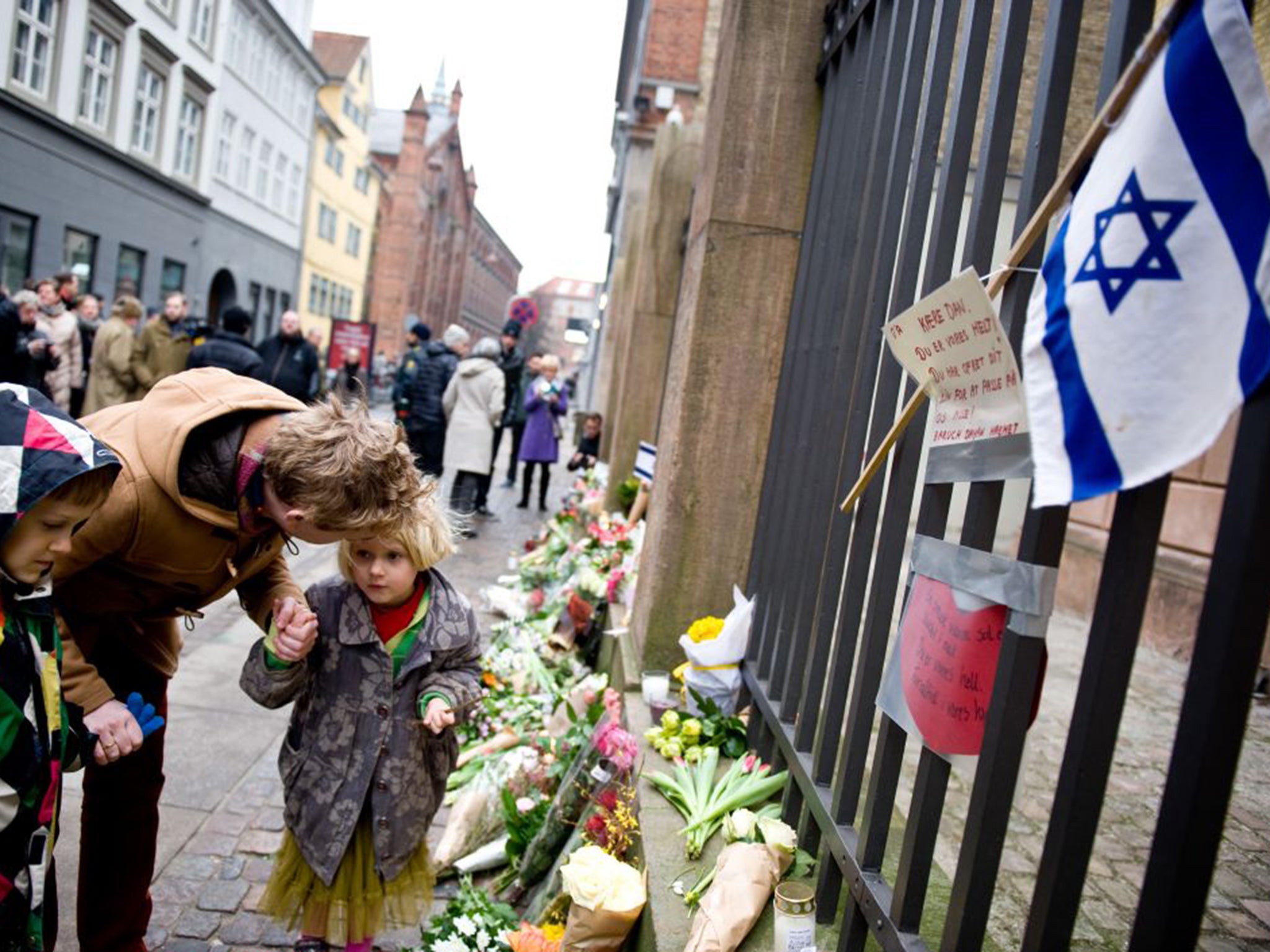 Tributes outside the synagogue where Dan Uzan was killed on Sunday in Copenhagen