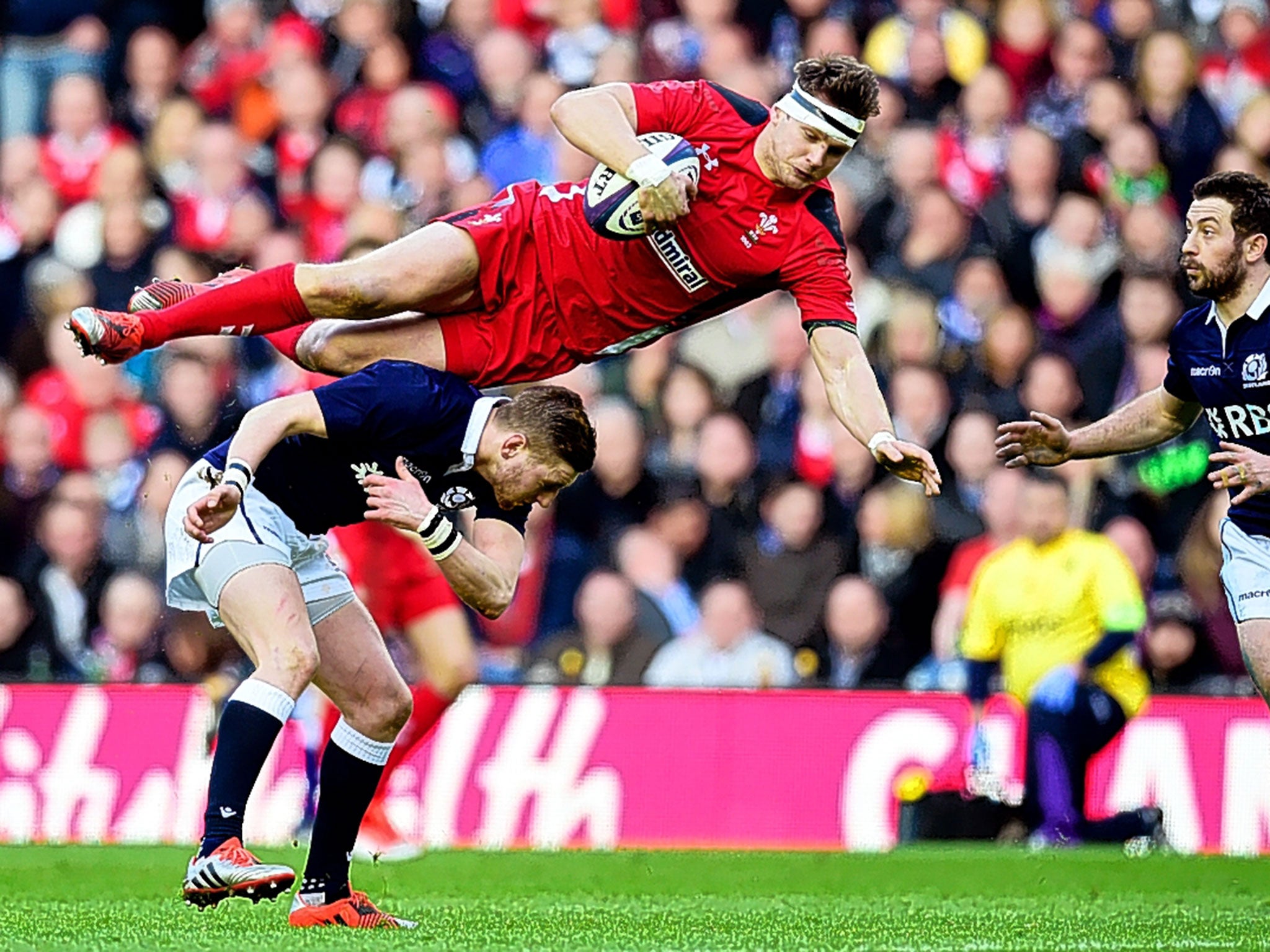 Scotland fly-half Finn Russell takes out his Welsh opposite number, Dan Biggar, during Sunday’s game at Murrayfield