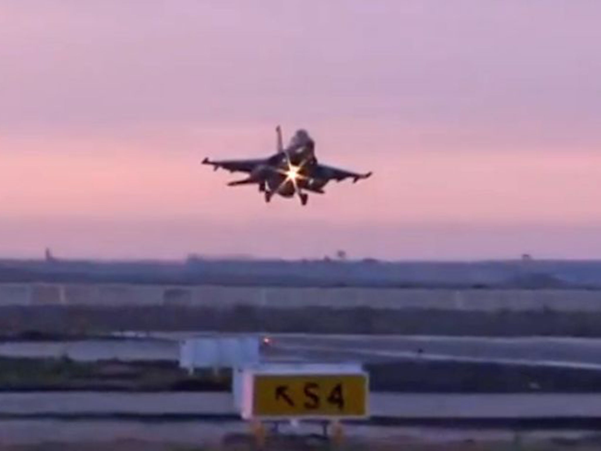 An Egyptian fighter jet returns from bombing Libya