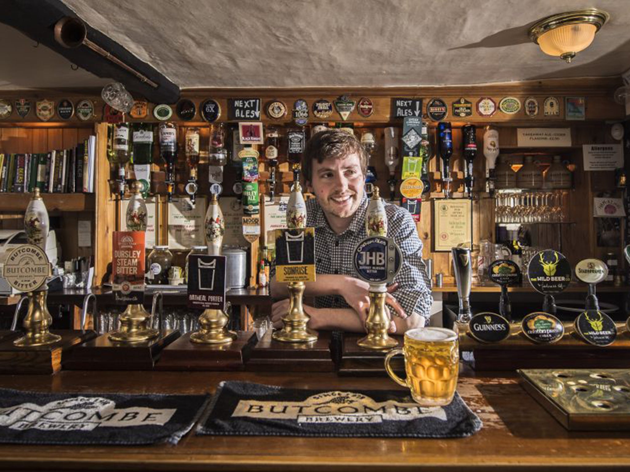 Peter Tiley tends the bar at The Salutation in Ham, Gloucester-shire