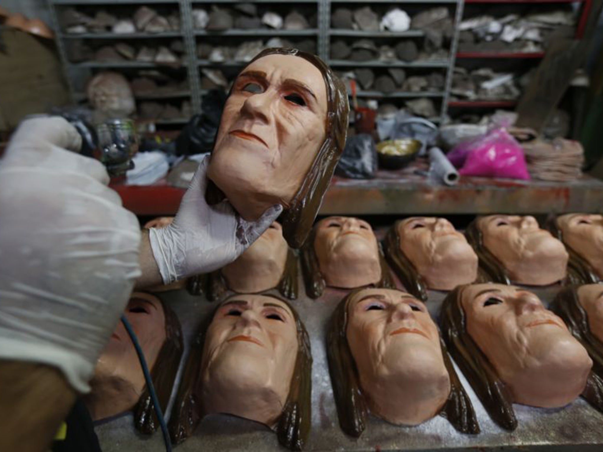 Masks of Maria das Graças Silva Foster, former Petrobras CEO, being prepared for the Rio Carnival, reflecting the high public profile of the unfolding scandal
