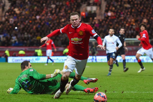 Wayne Rooney wins a penalty after going down under the challenge of Thorsten Stuckmann