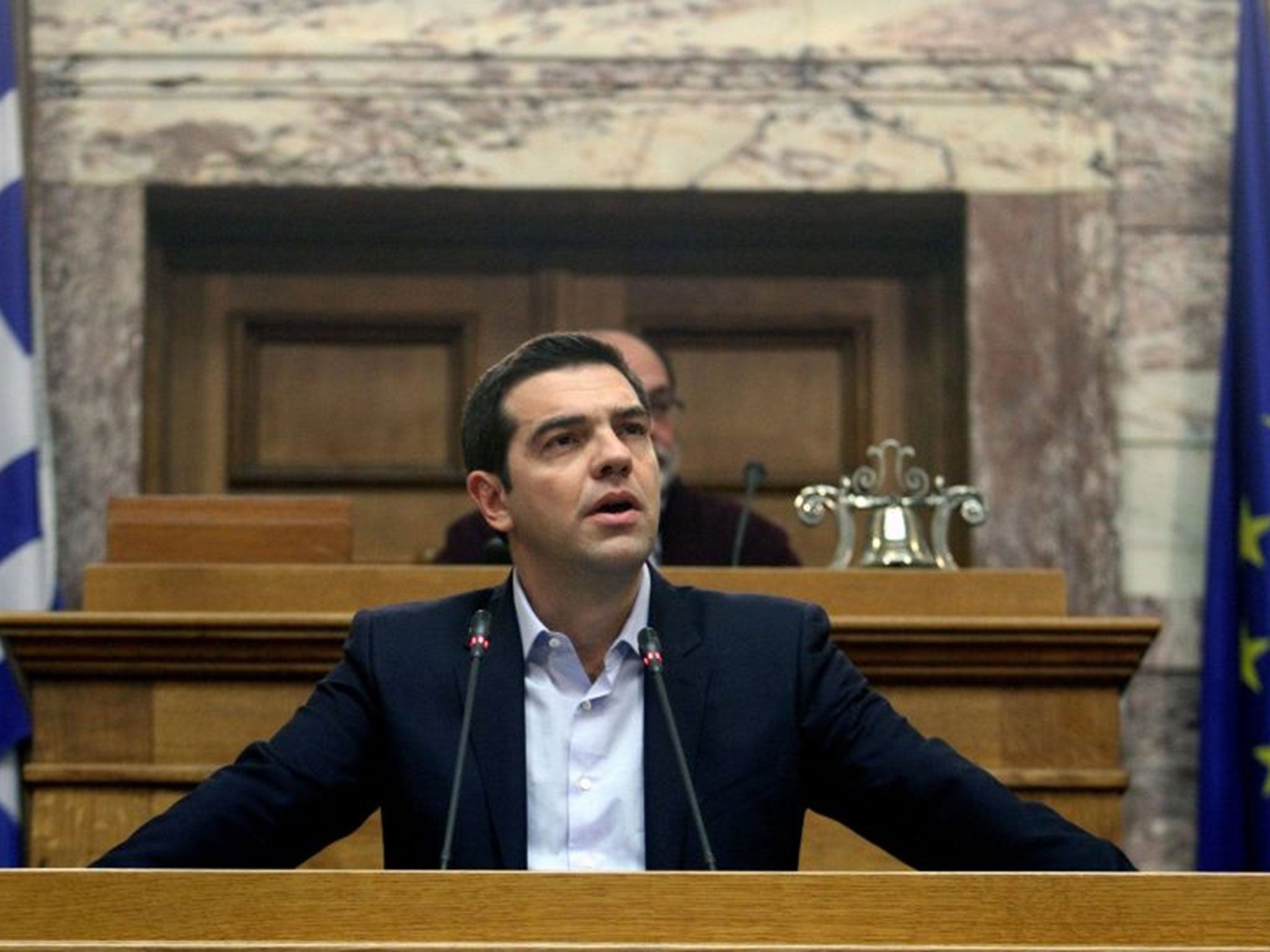 Greek Prime Minister Alexis Tsipras addresses his party lawmakers during a meeting of their parliamentary group at the Parliament in Athens, Greece