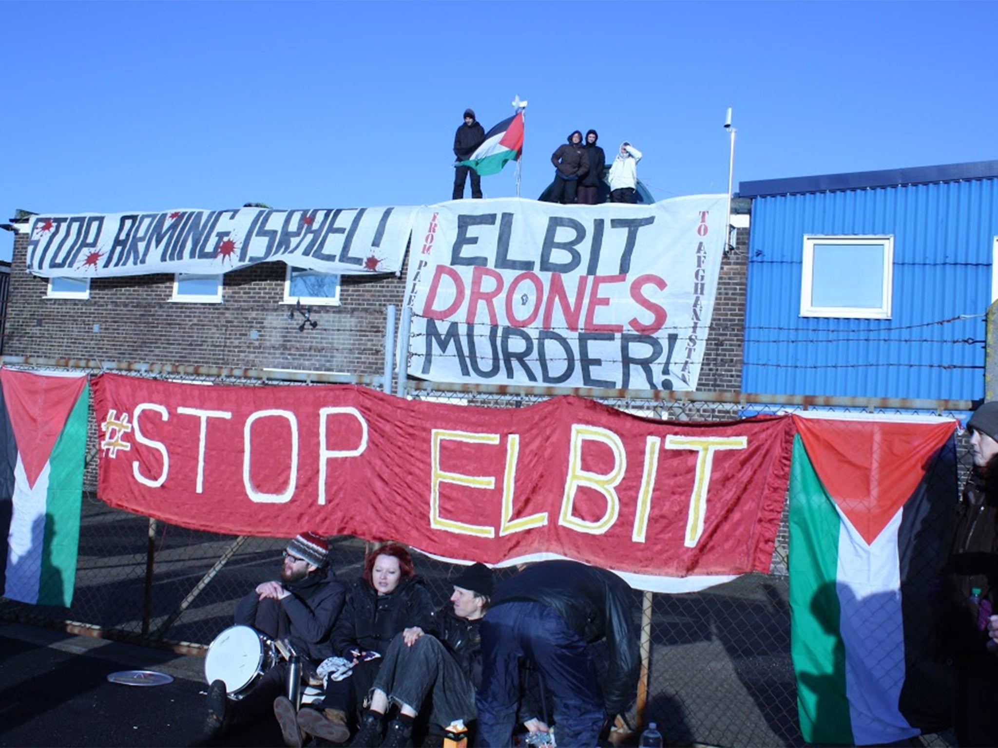 Pro-Palestinian protesters on the roof of the building in Broadstairs