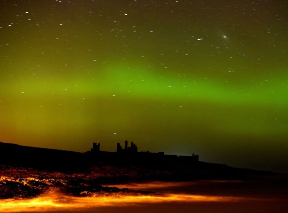 The aurora borealis, or the northern lights as they are commonly known at Dunstanburgh Castle in Northumberland.