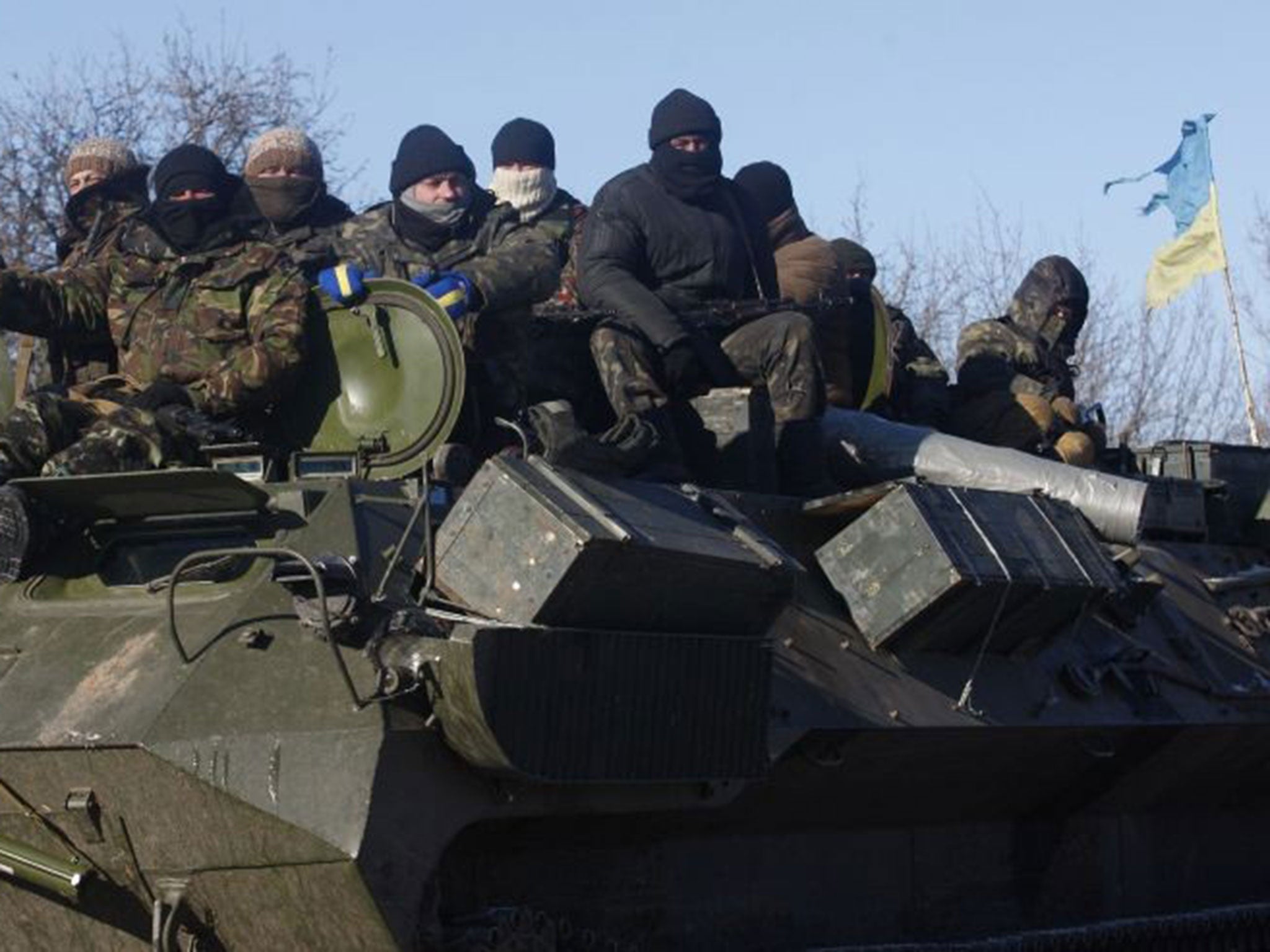 Ukrainian servicemen ride on the way from Artemivsk to Debaltseve on 17 February
