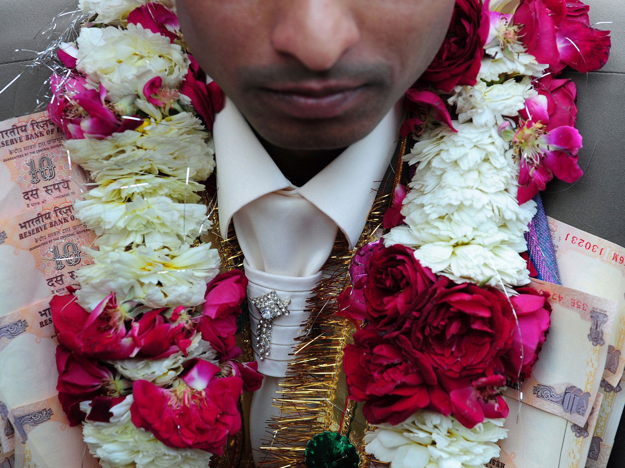 The couple were exchanging traditional flower garlands when the groom had a seizure