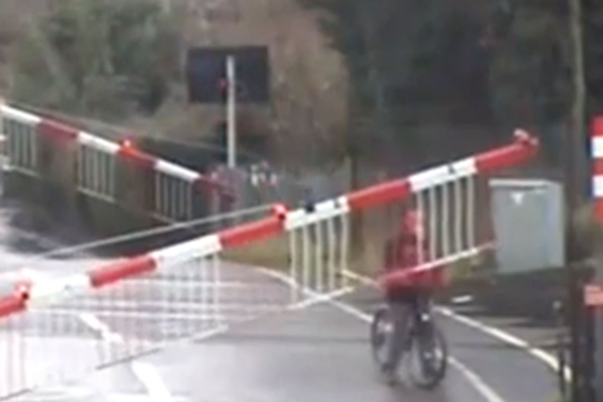 CCTV footage captures near miss after cyclist gets himself trapped on ...