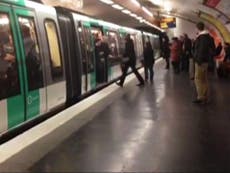 French police hunt for football fans filmed pushing black man off Paris Metro