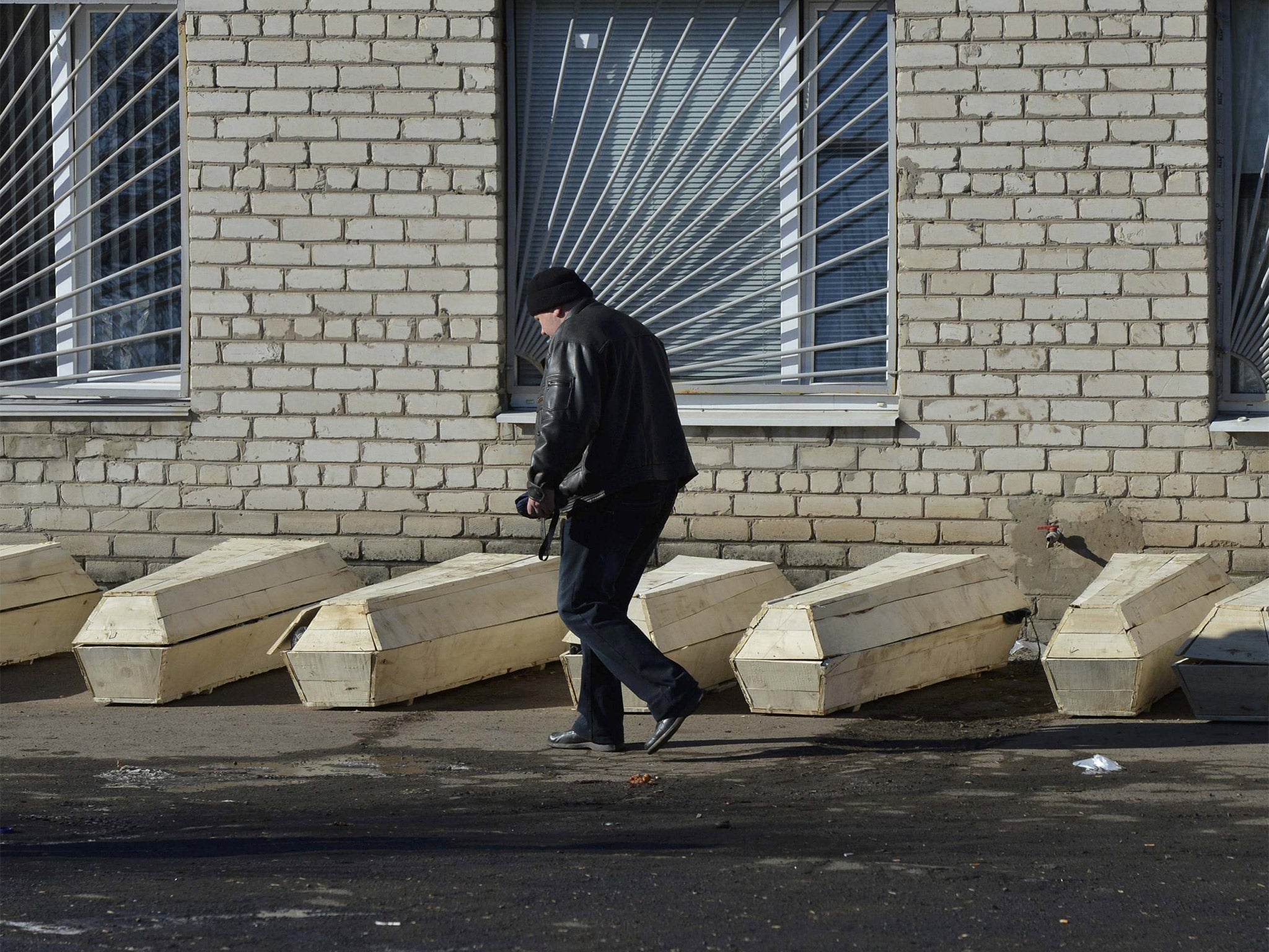 Coffins containing bodies of killed Ukrainian soldiers are pictured outside a morgue in Artemivsk