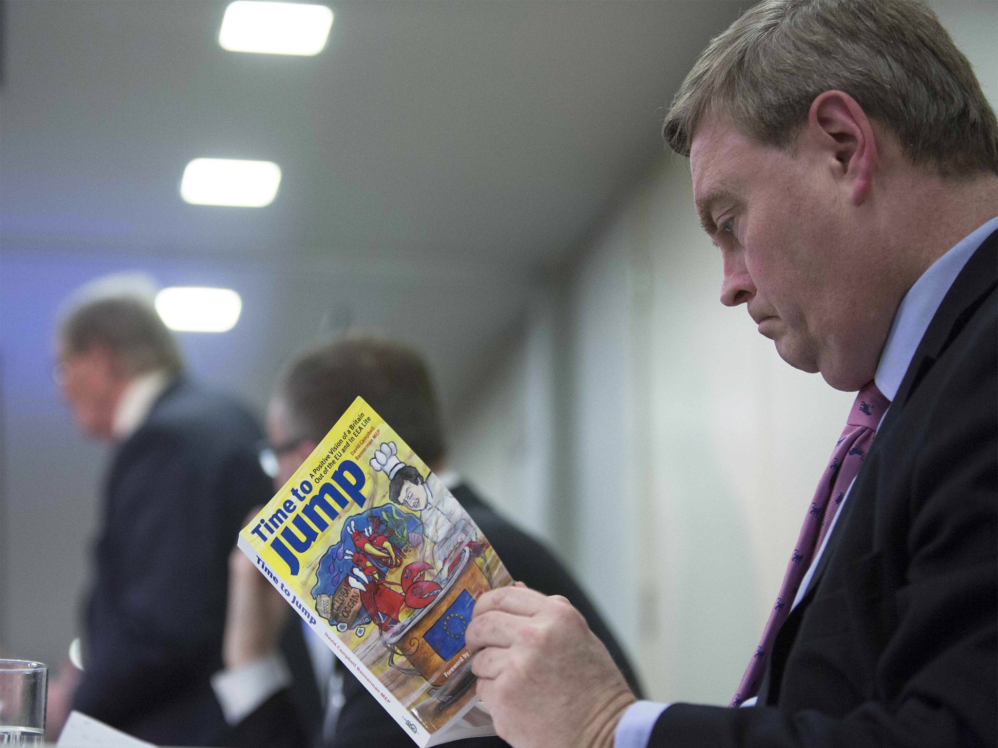 Conservative MEP David Campbell Bannerman with a copy of his book, 'Time to Jump', the cover of which shows a British lobster being boiled alive by Brussels