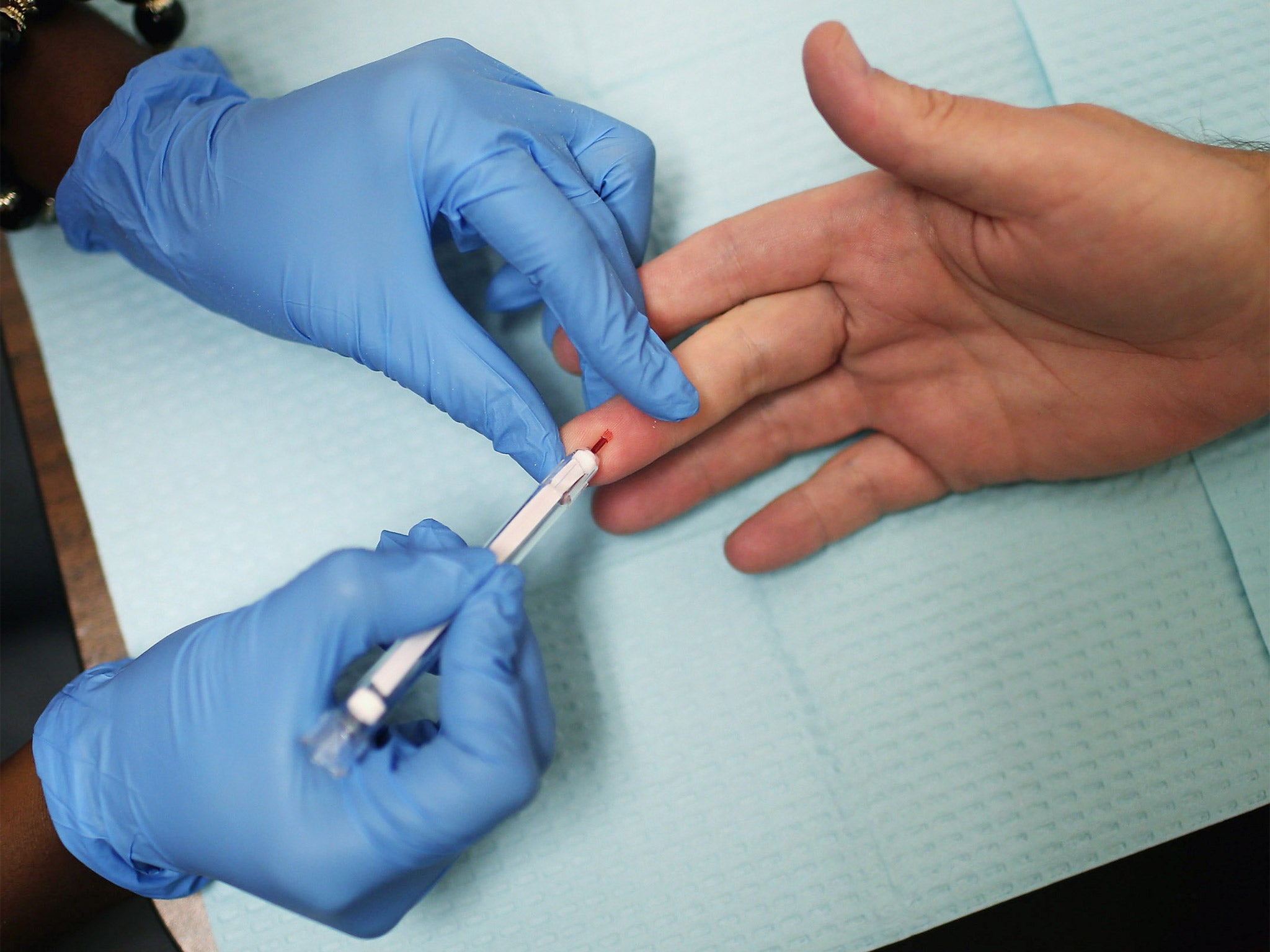 An HIV test is carried out. An Aids vaccine is now a distinct possibility in the future 