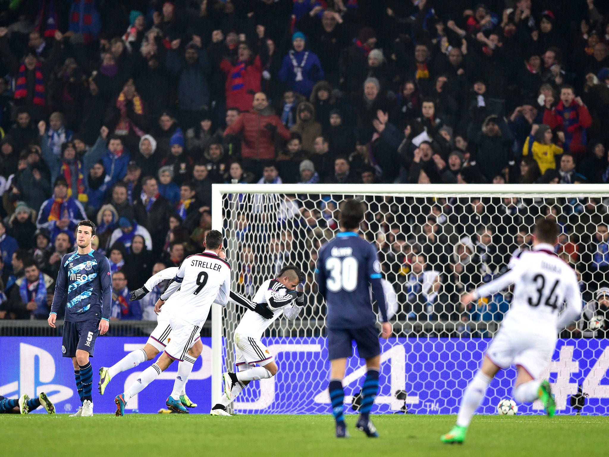 Basel's Paraguayan midfielder Derlis Gonzalez (C) celebrates after opening the scoring