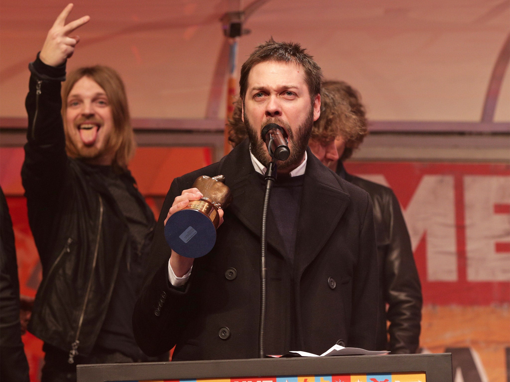 Tom Meighan of Kasabian collects the Best Album Award