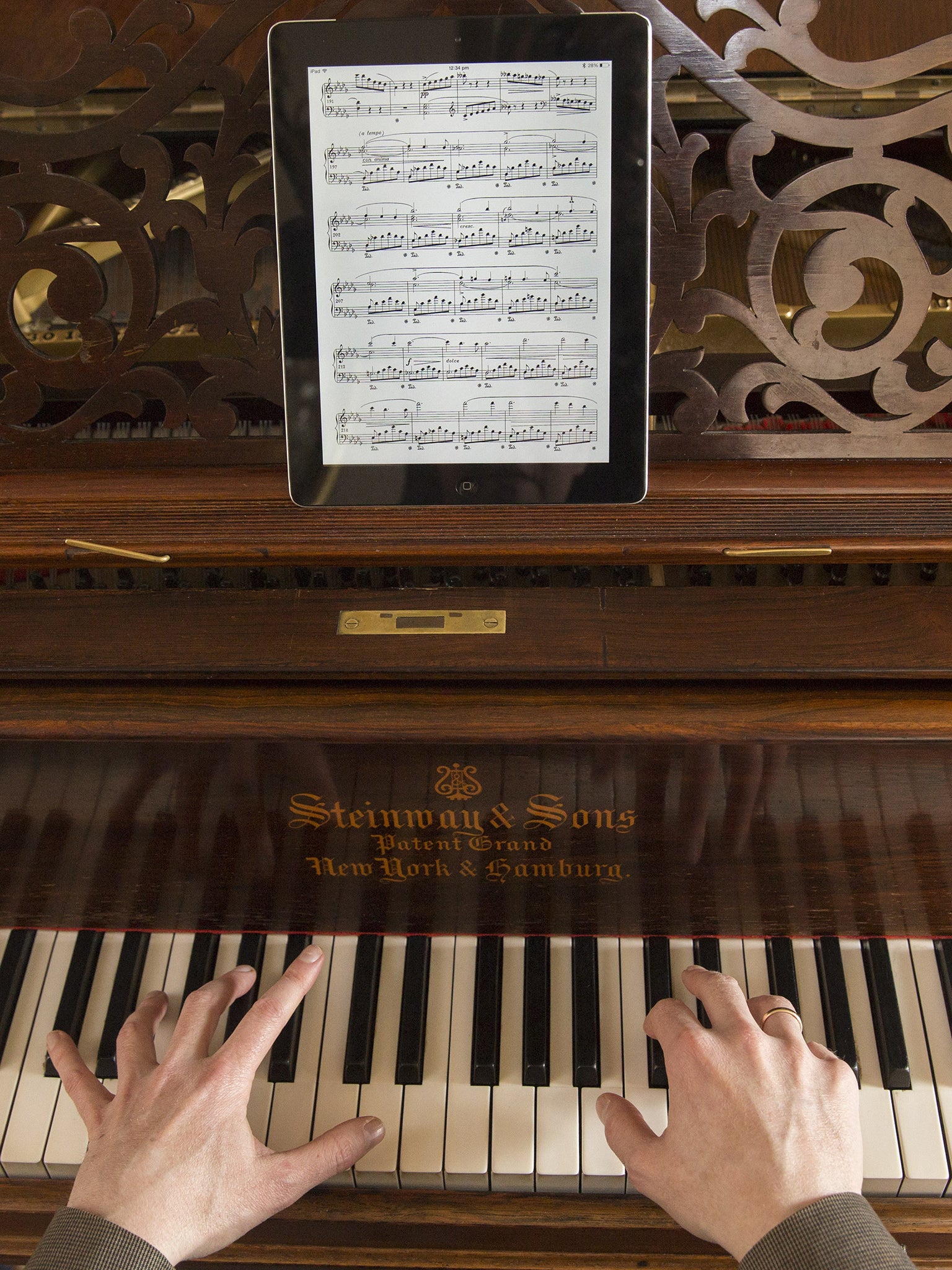 Music can be displayed on an iPad with the pianist turning the pages using a Bluetooth pedal