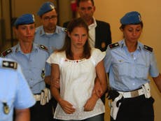 Meredith Kercher's killer, Rudy Guede, says she tried to tell him something as she died and Amanda Knox was '101 per cent' there