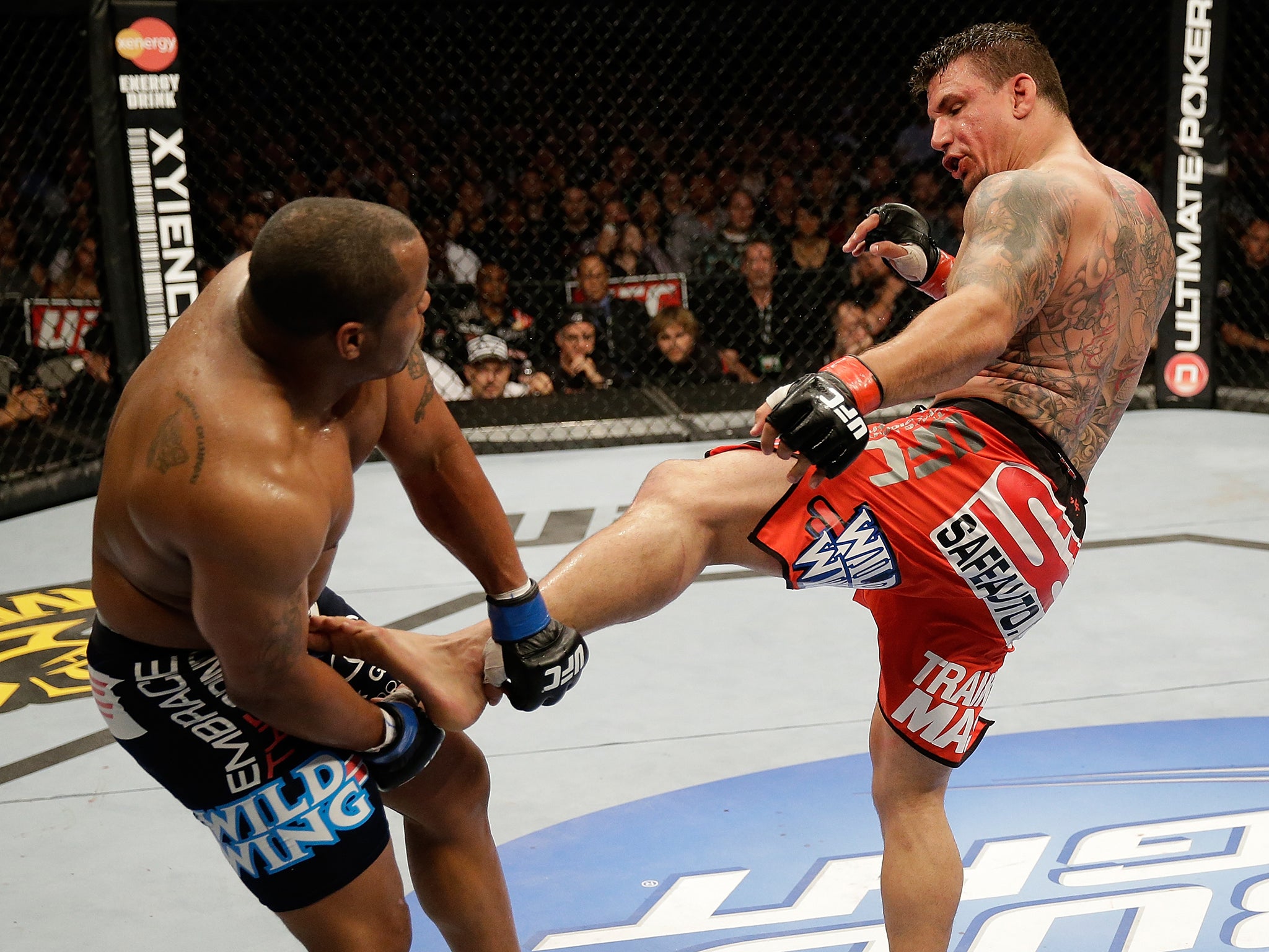 Frank Mir kicks Daniel Cormier in their heavyweight bout