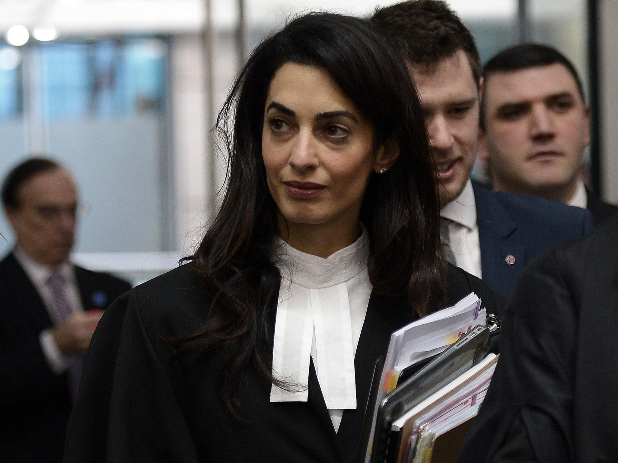 Amal Clooney has joined the legal team defending 'The Hooden Men'