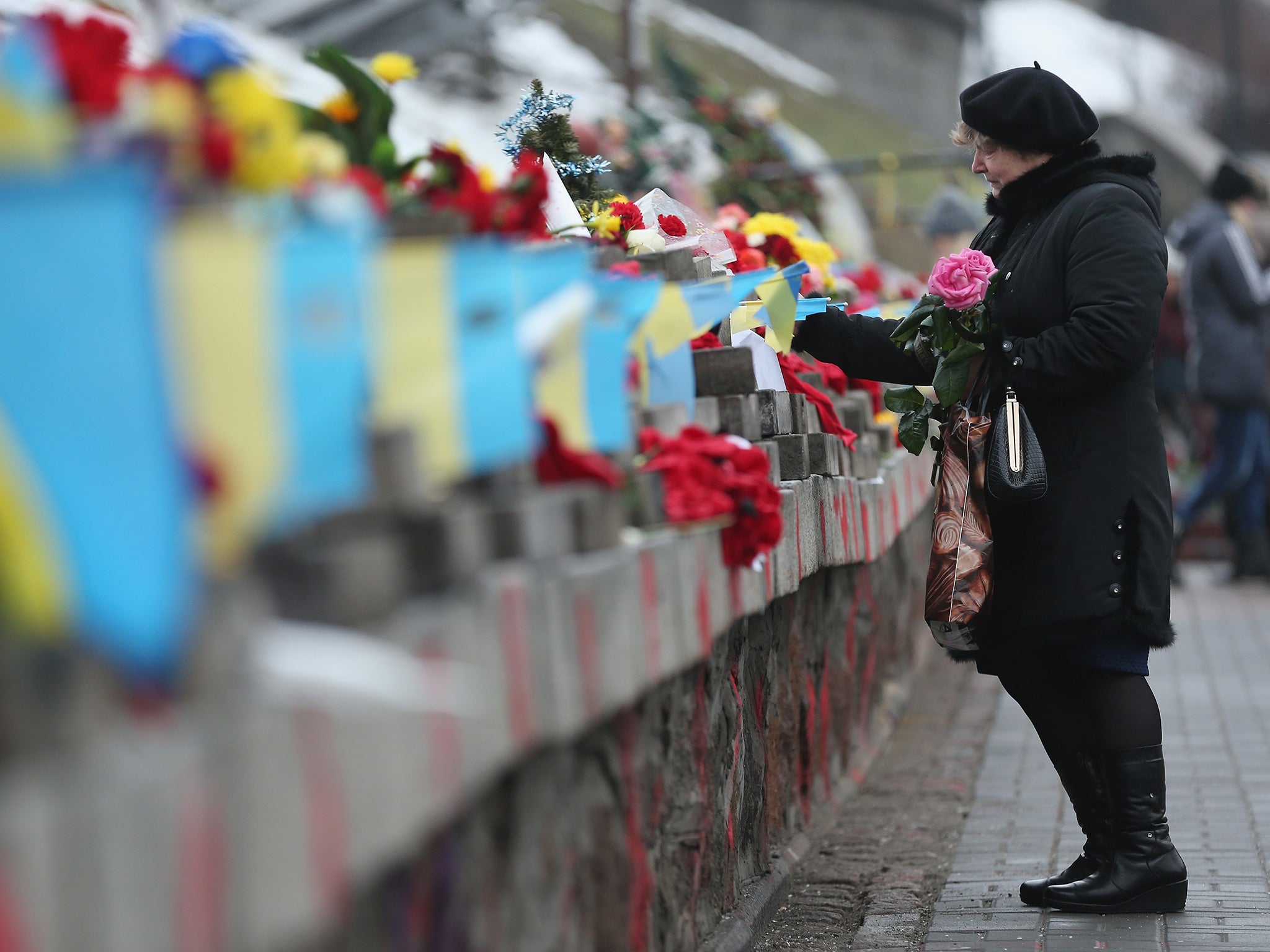 A floral tribute to the 88 victims of the clashes at Maidan (Getty)