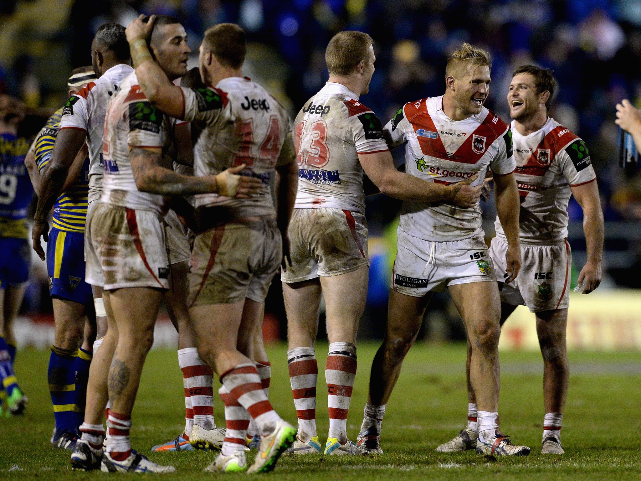 St George Illawarra players celebrate their 18-12 victory over Warrington