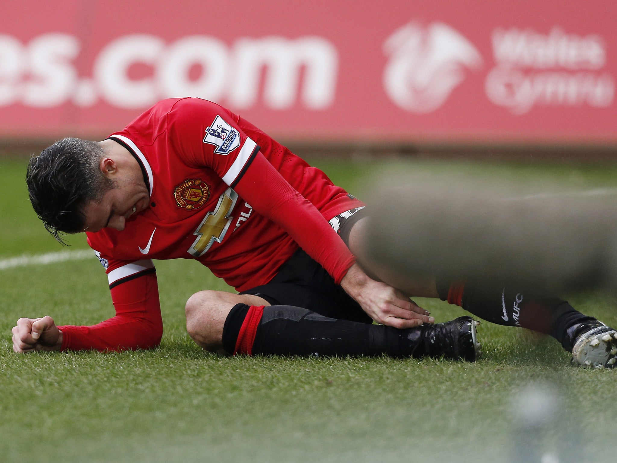 Robin van Persie suffers an ankle injury at the Liberty Stadium