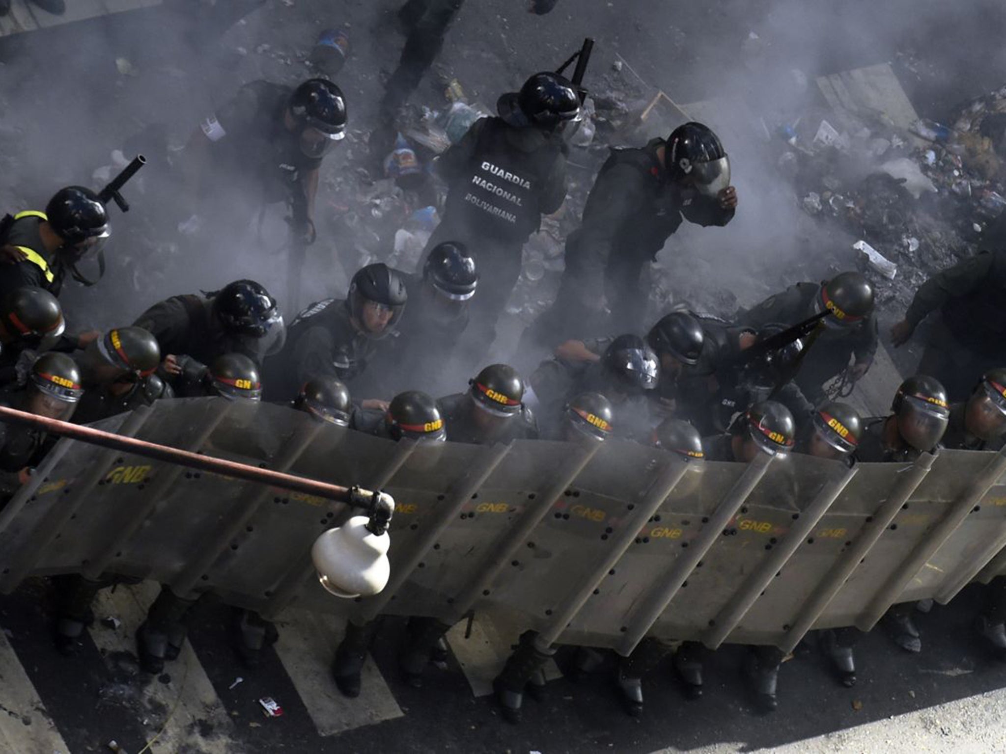 The Venezuelan National Guard police an opposition protest