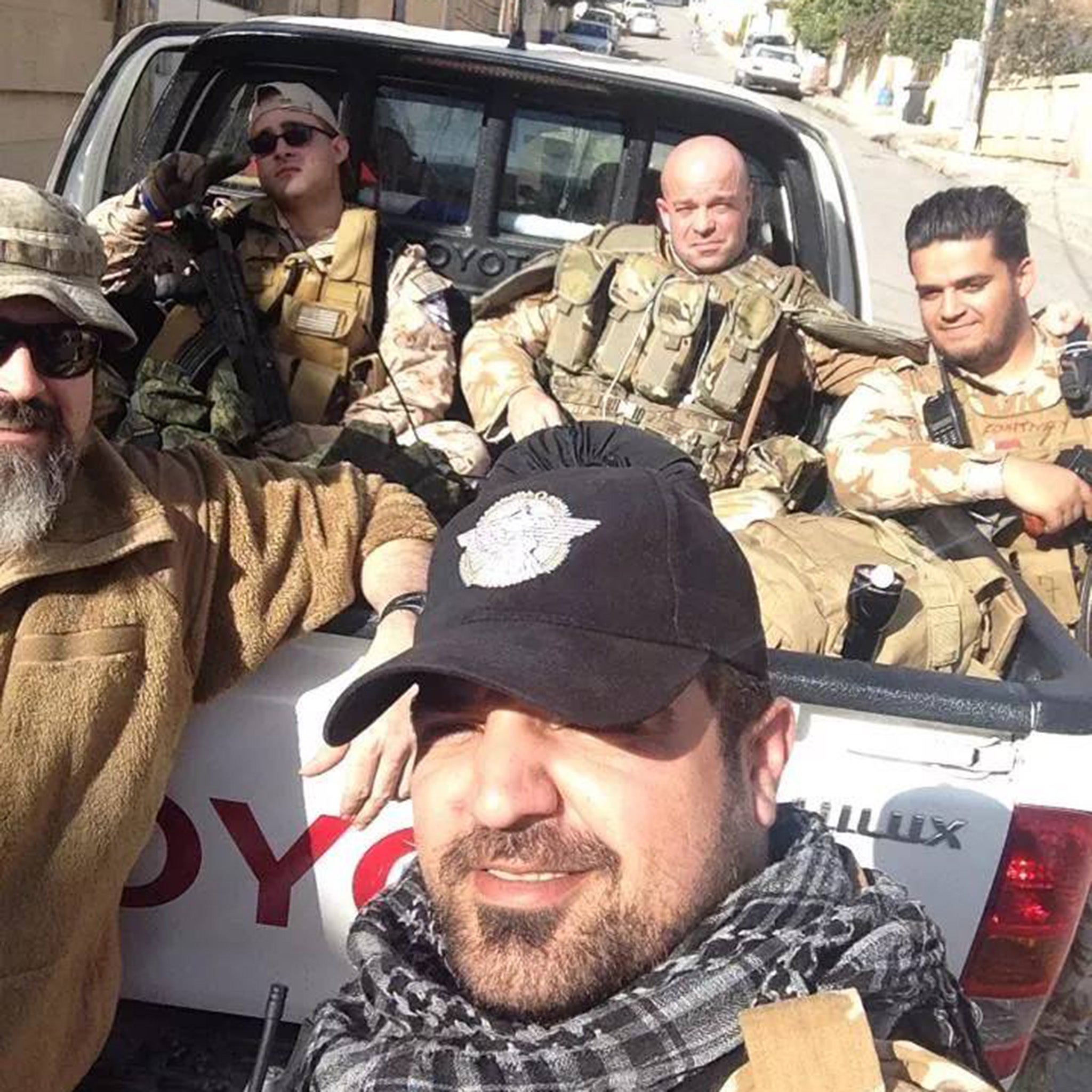 Brothers in arms: Locke with the Christian militia Dwekh Nawsha – which translates from Assyrian as self-sacrificers