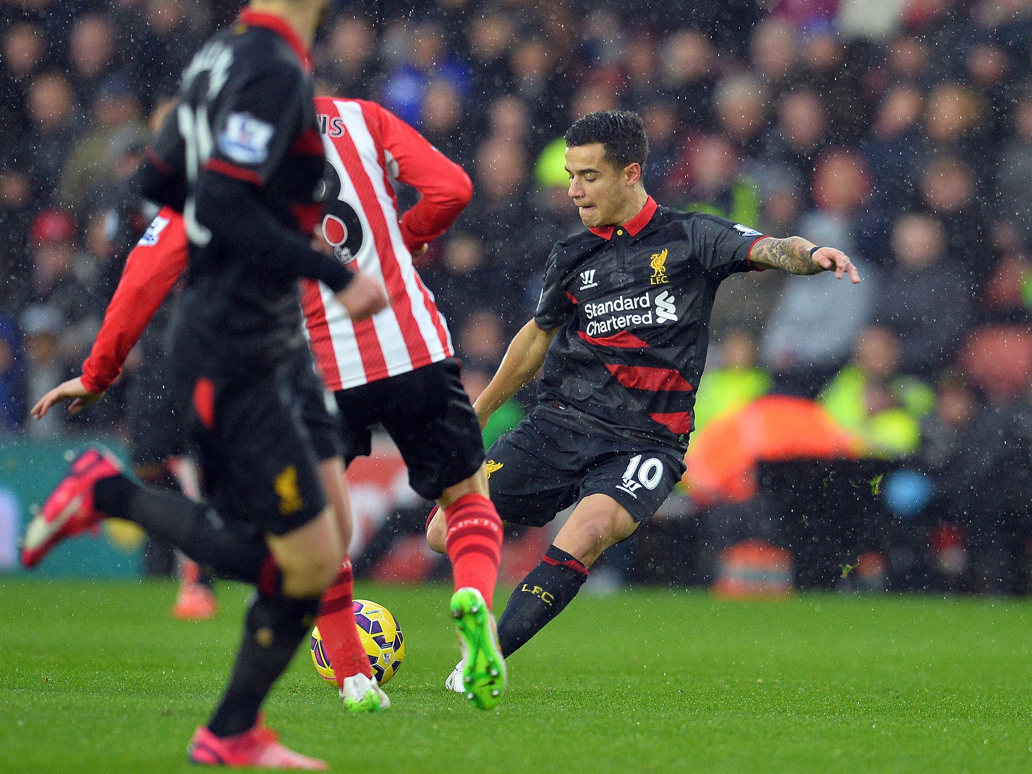 Liverpool's Brazilian midfielder Philippe Coutinho strikes the opening goal against Southampton