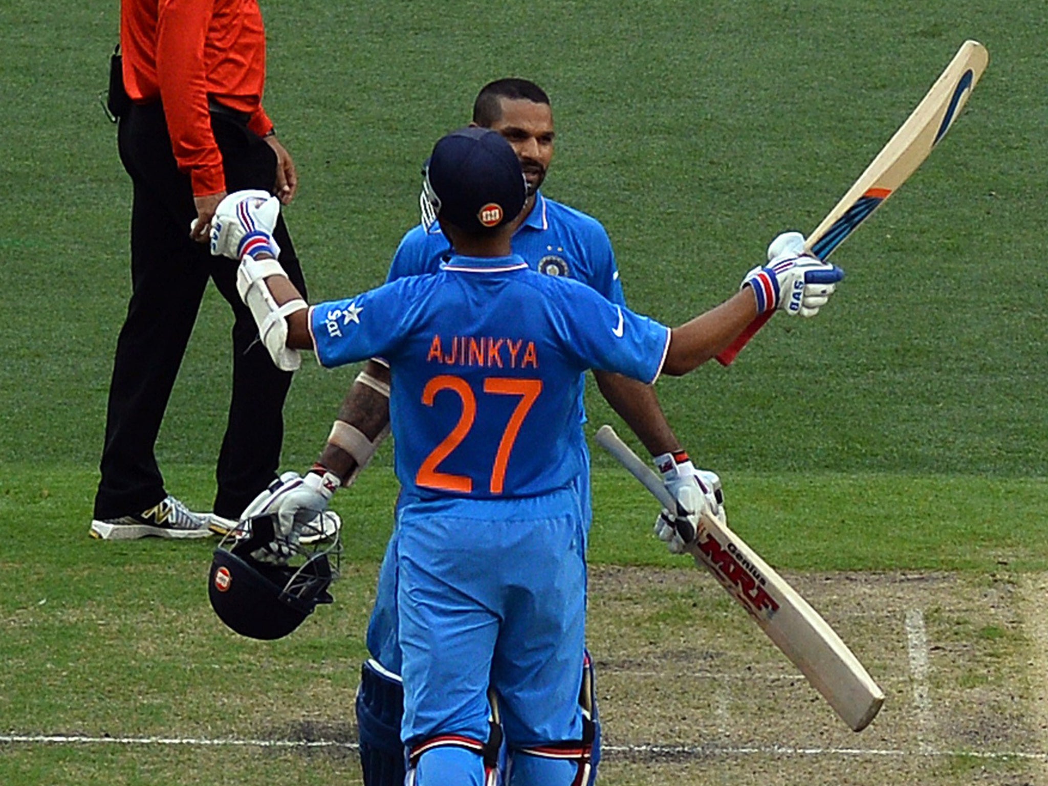 Shikhar Dhawan celebrates with teammate Ajinkya Rahane