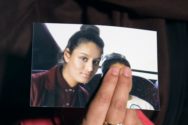 Renu Begum, eldest sister of Shamima Begum, 15, holds her sister's photo