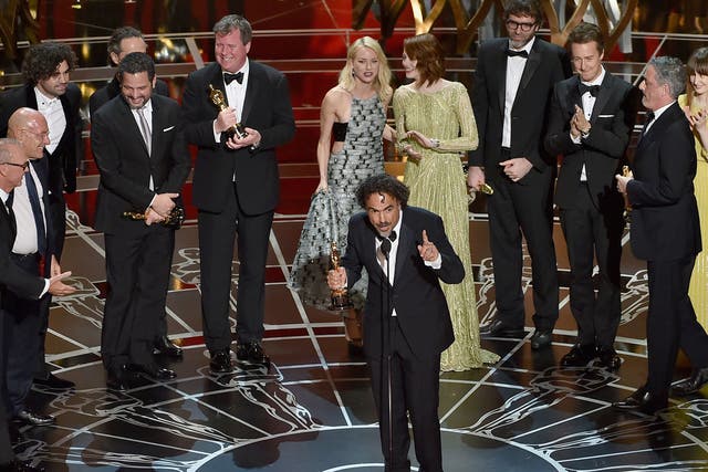 The cast and crew of Birdman accept their Best Picture Oscar on stage