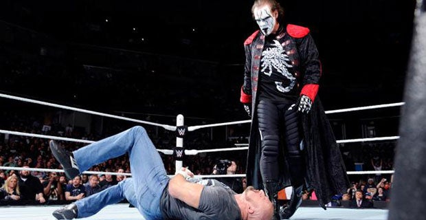 Sting stands tall over Triple H
