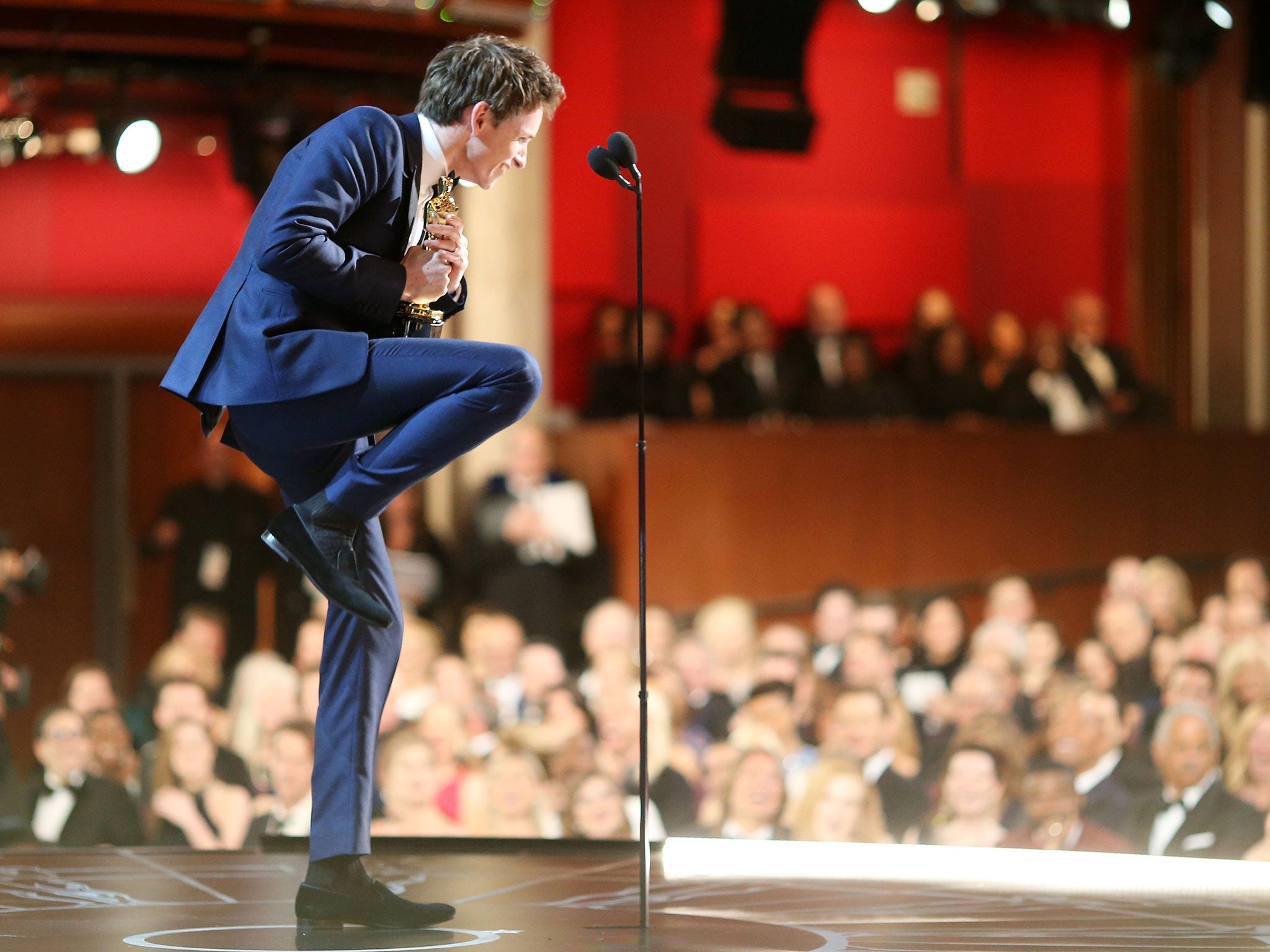 Eddie Redmayne gets excited by the word 'Oscar' on stage at the Academy Awards