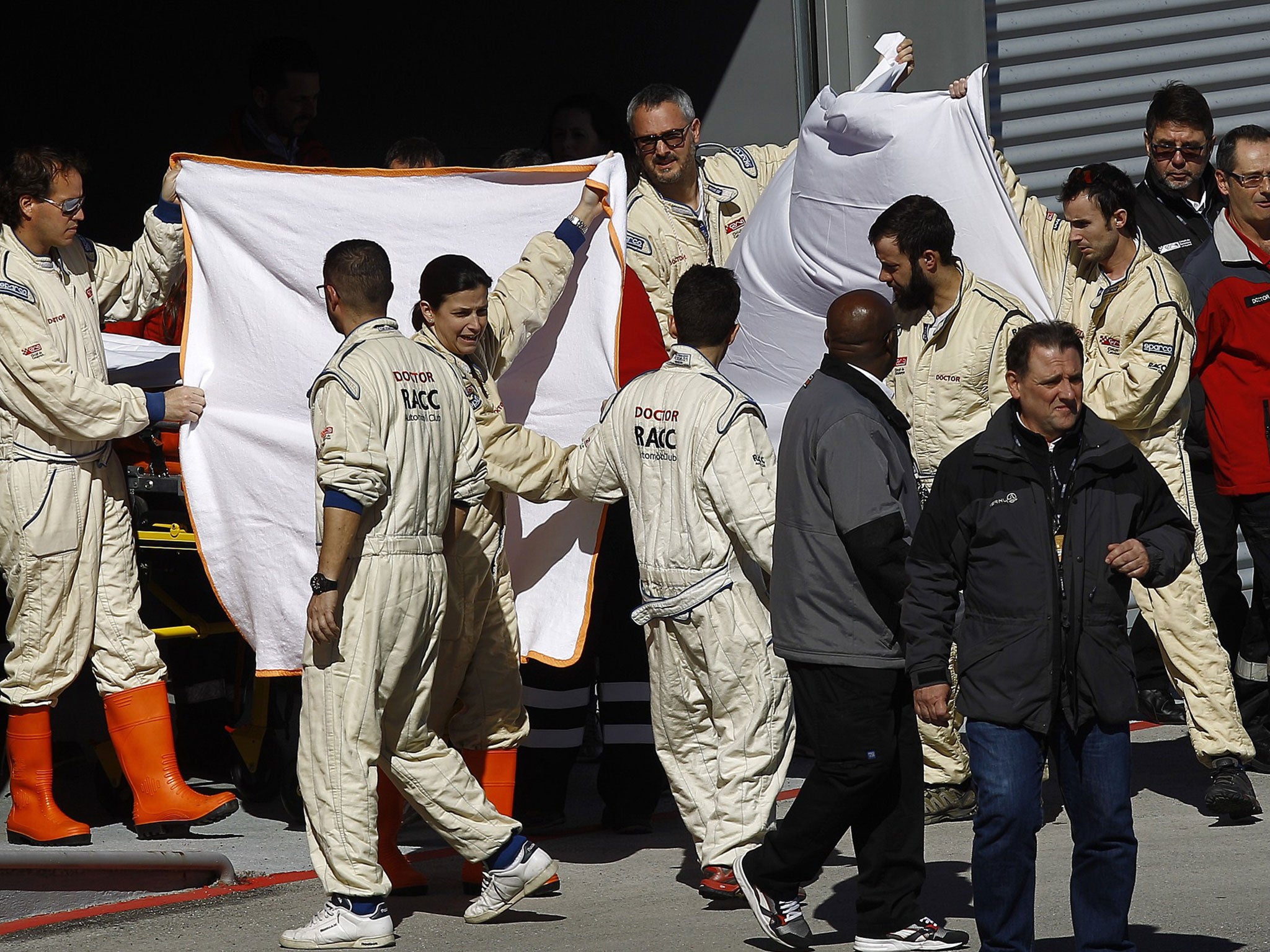 Alonso is transported from the medical centre at Catalunya to a helicopter