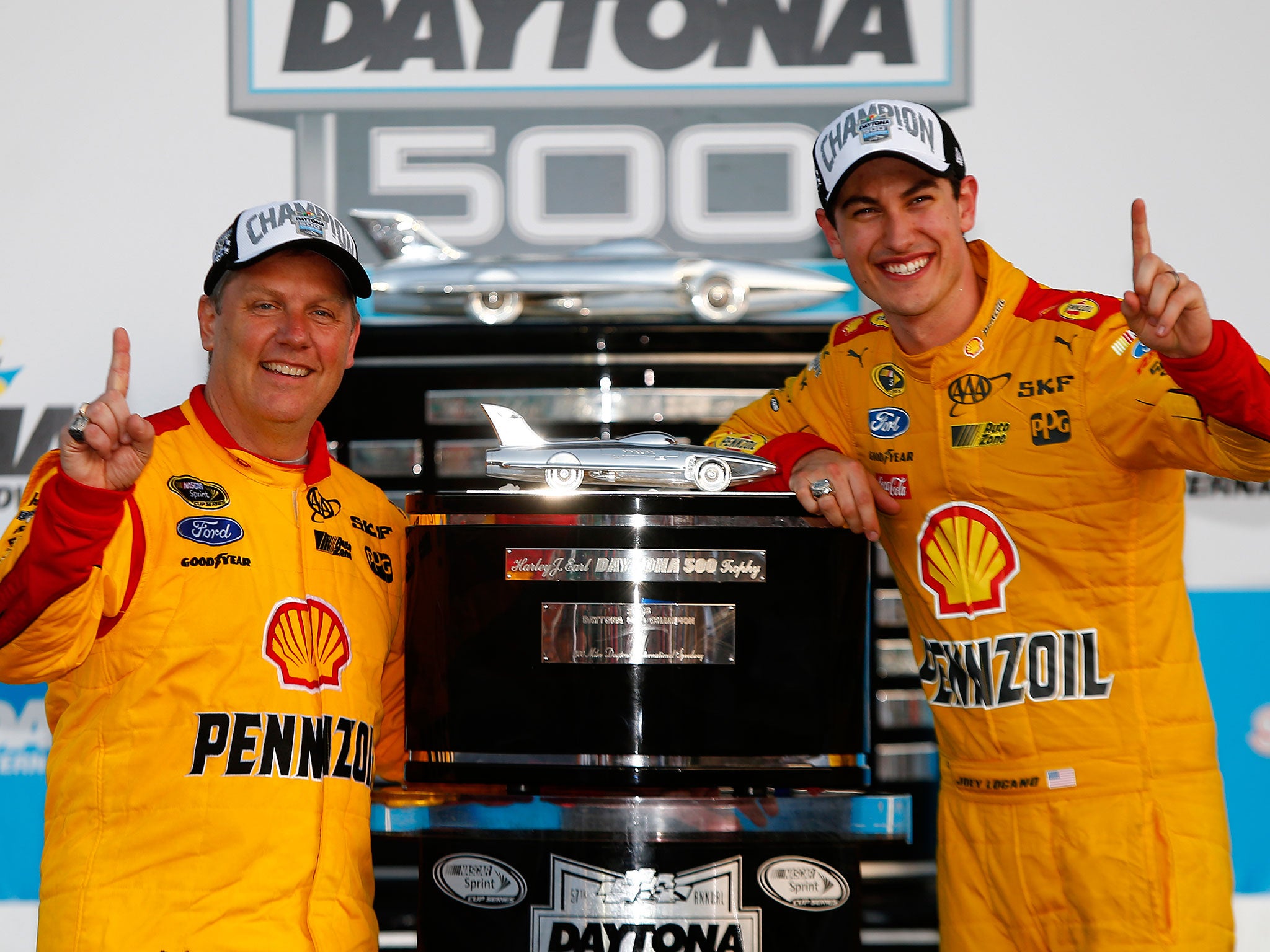 Logano celebrates with his crew chief Todd Gordon