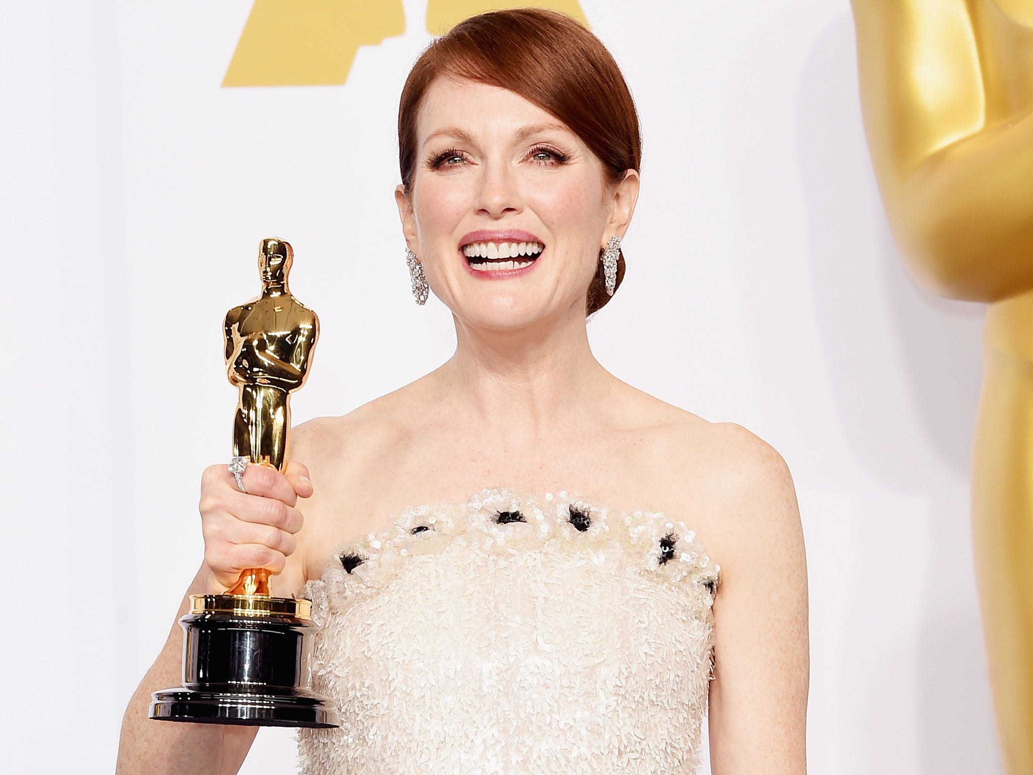 Actress Julianne Moore wins the Best Actress in a Leading Role Award for 'Still Alice' during the 87th Annual Academy Awards in Hollywood, California