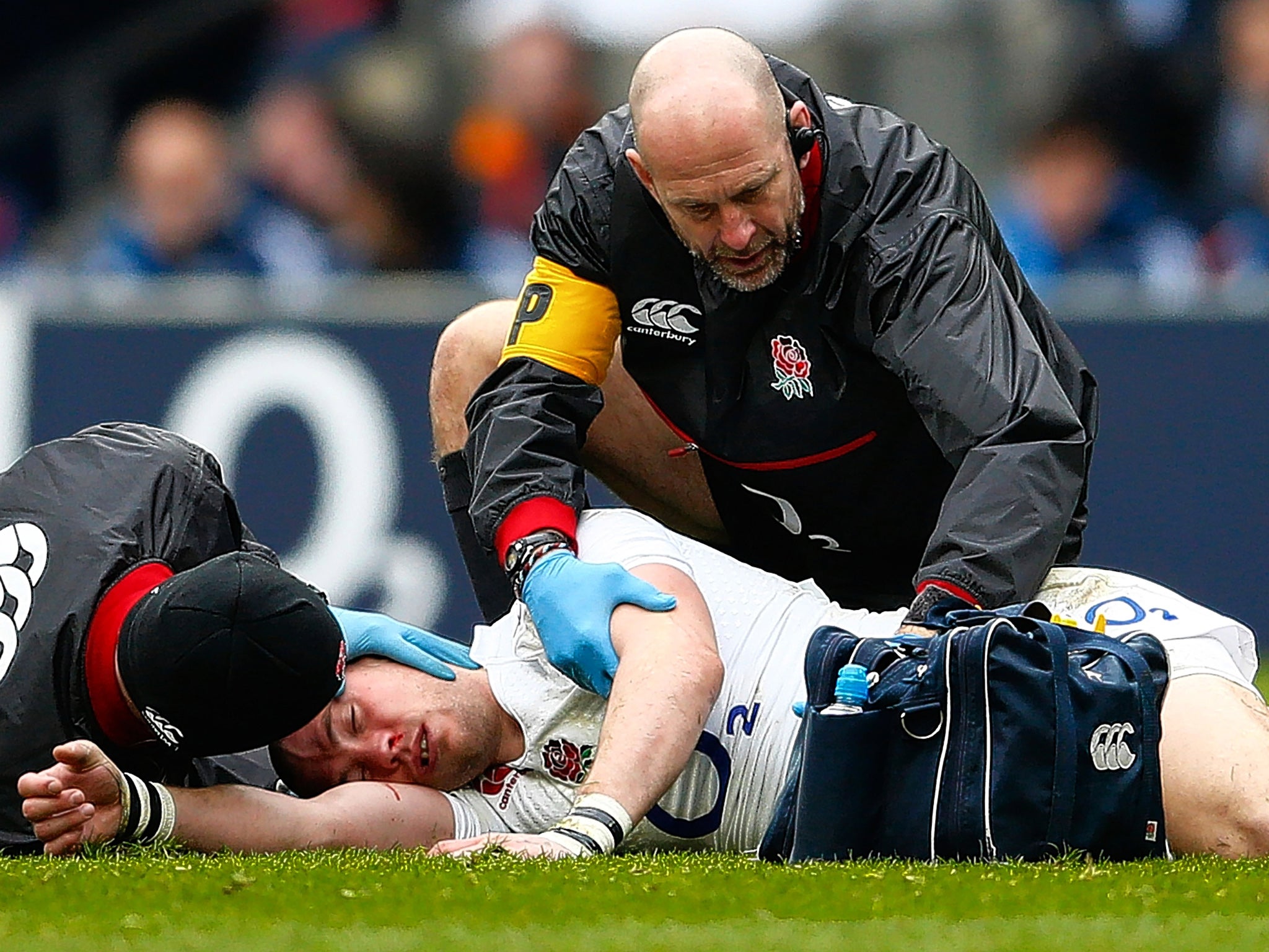 Mike Brown is treated after being knocked out cold in the early stages of England’s win over Italy 10 days ago