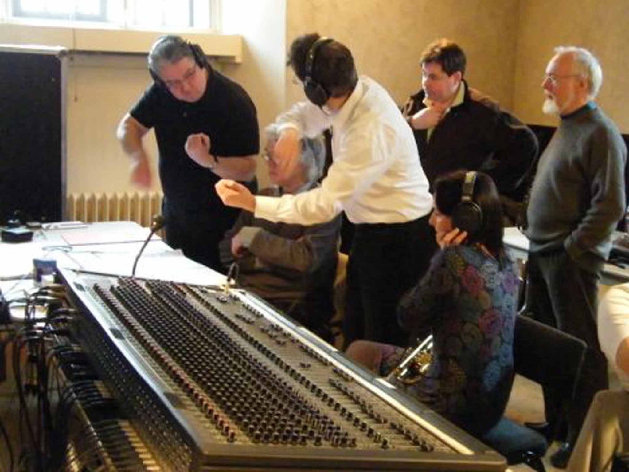 McCabe, far right, oversees a session to record his 'Rainforest II', at the Henry Wood Hall in London