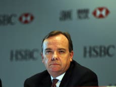 HSBC chief Stuart Gulliver sees pay fall amid sliding profits 