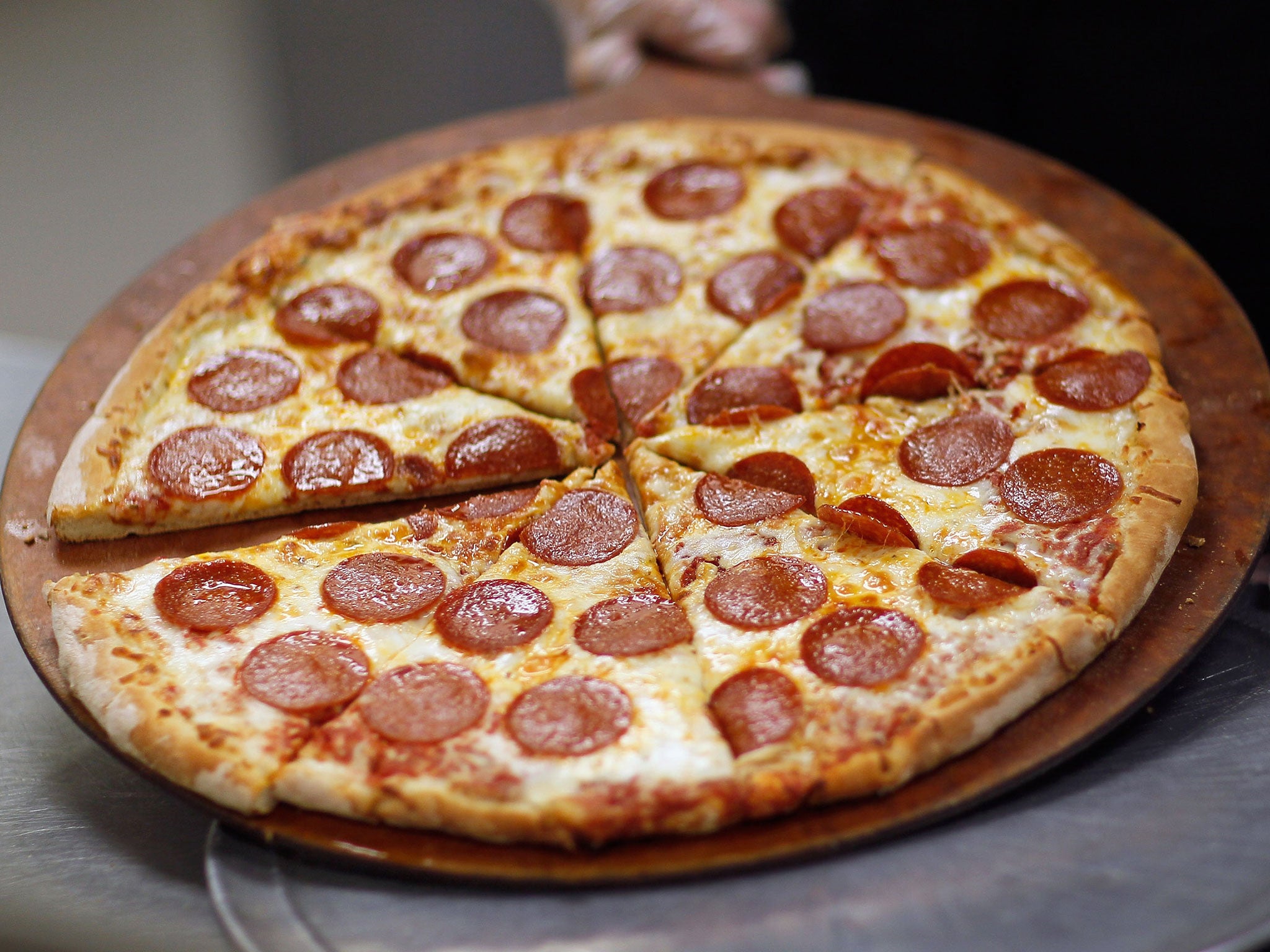 German vans have reportedly been delivering up to 60 pizzas at one time to Swiss customers