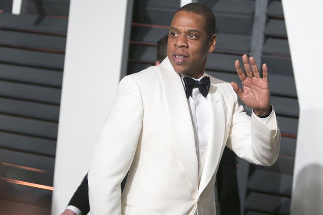 Jay Z goes for white on the Oscars red carpet